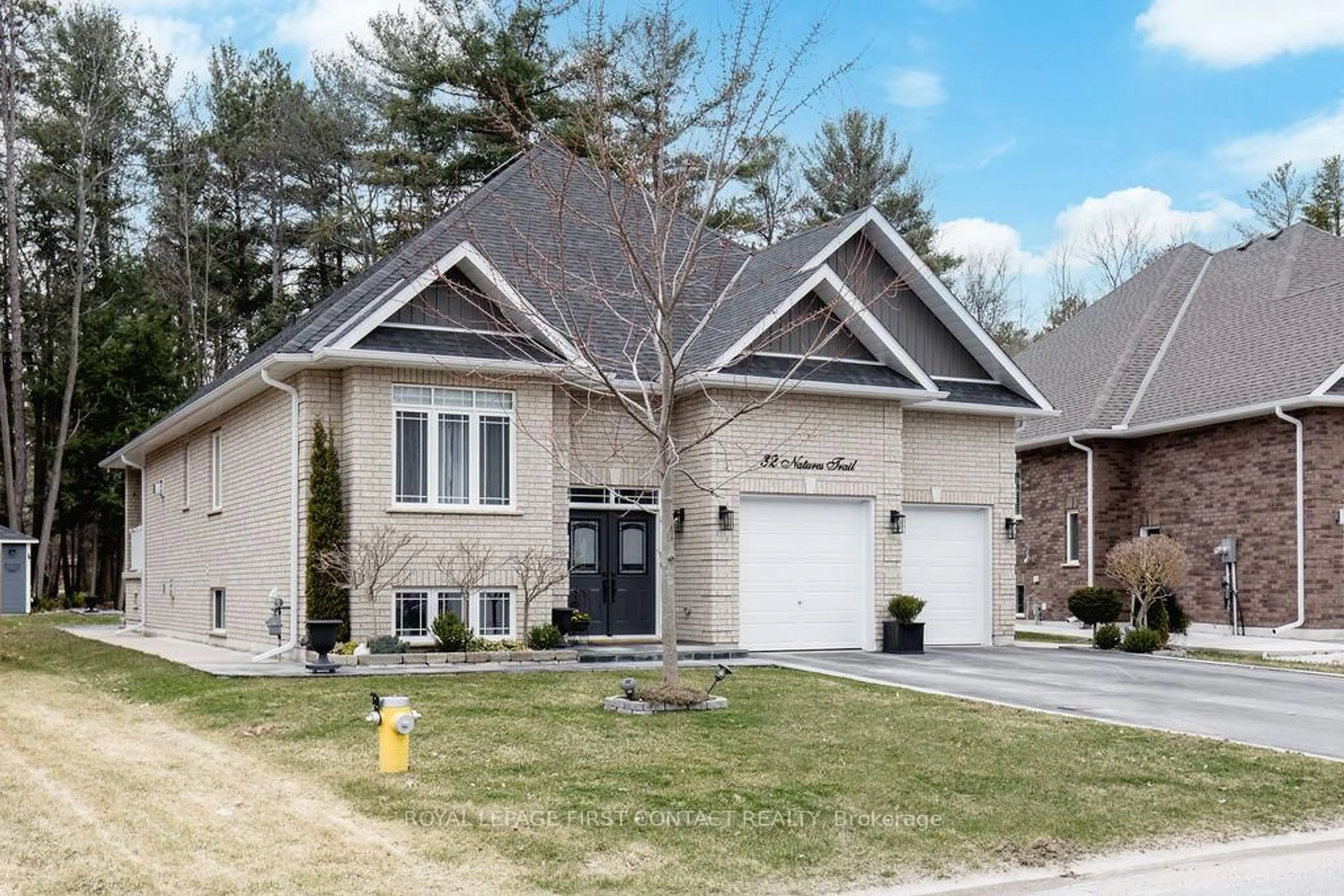 Home with brick exterior material, street for 32 Natures Tr, Wasaga Beach Ontario L9Z 0H4