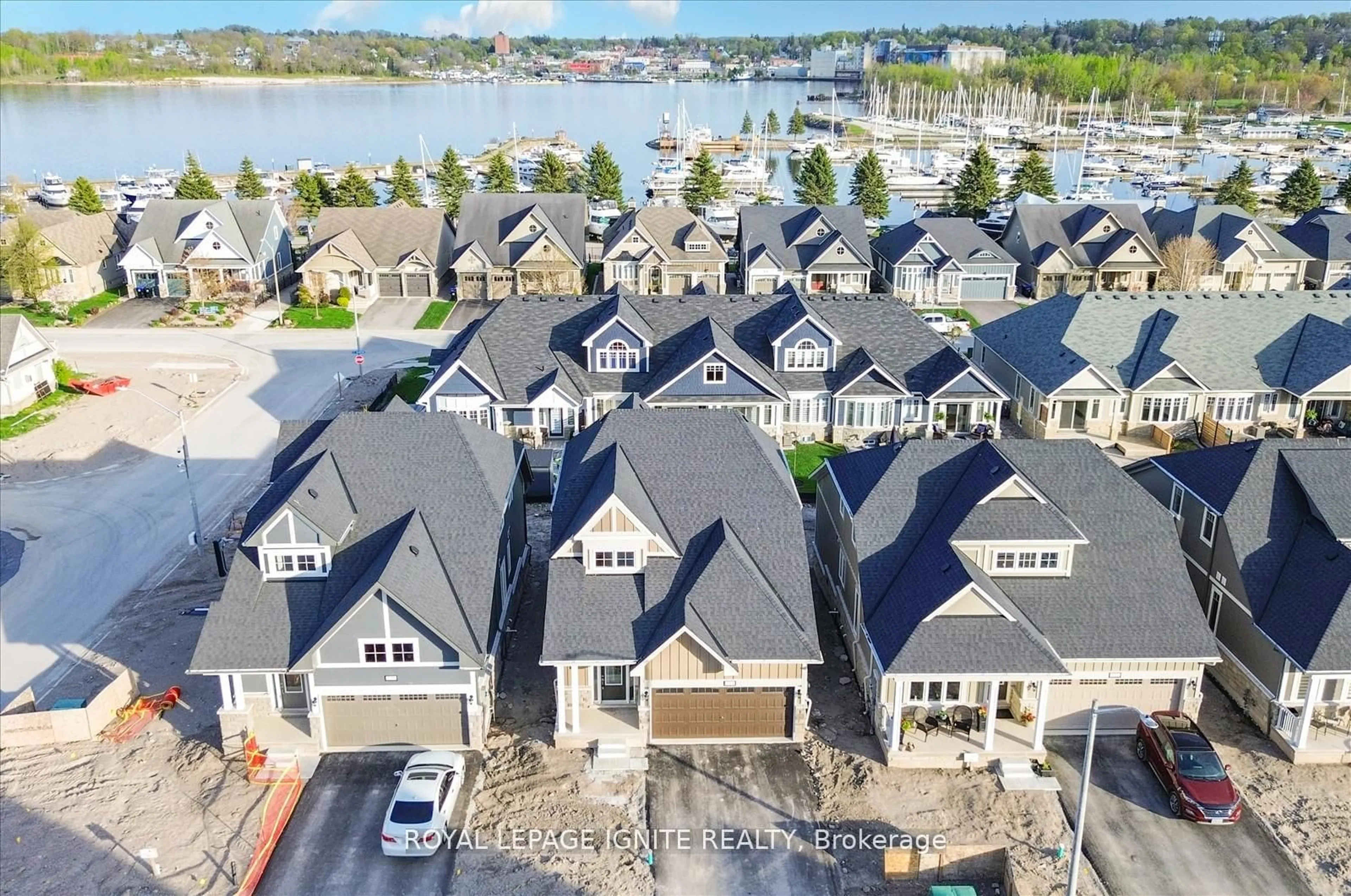 A pic from outside/outdoor area/front of a property/back of a property/a pic from drone, water/lake/river/ocean view for 519 Hudson Cres, Midland Ontario L4R 0J2