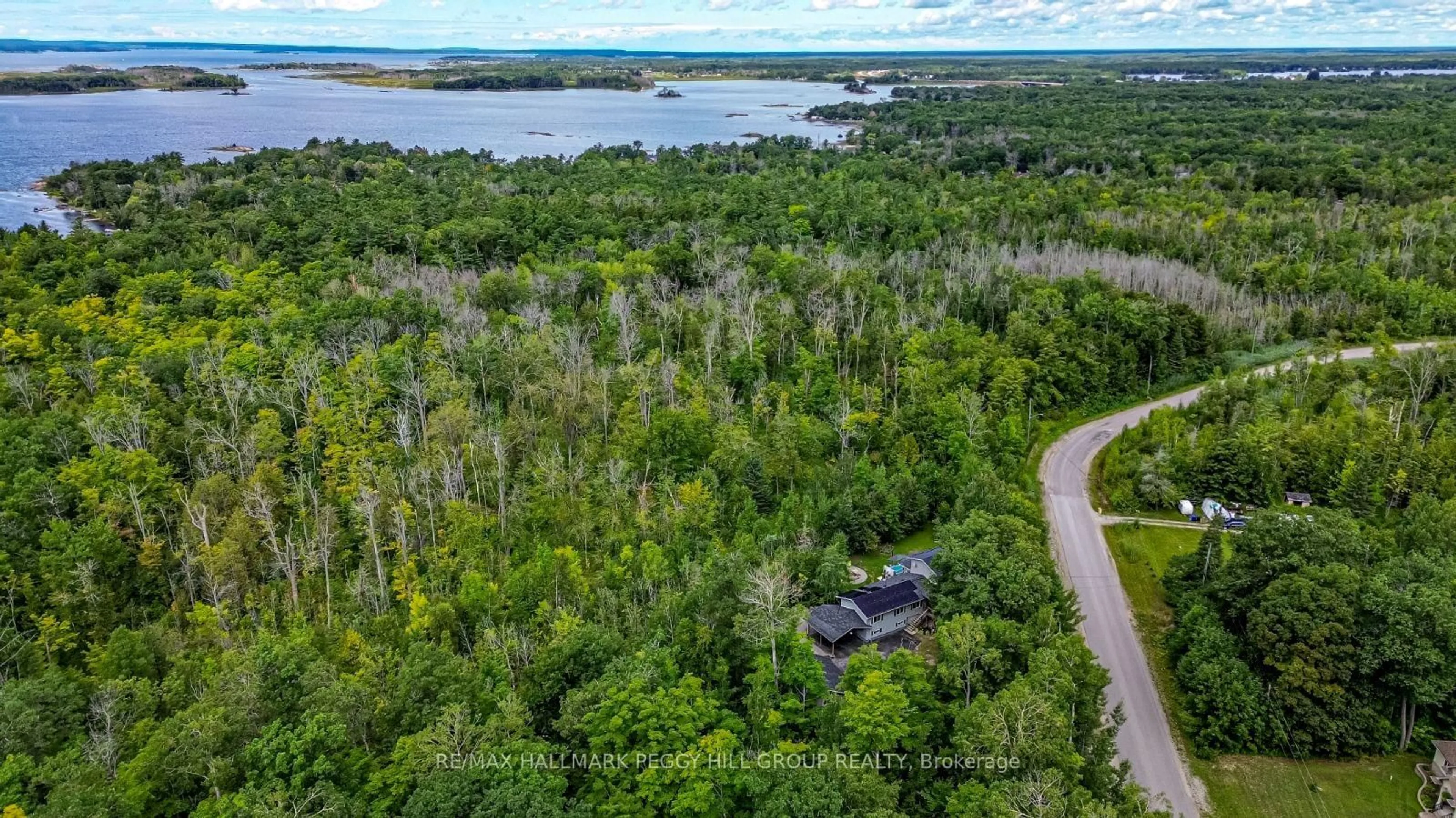 A pic from outside/outdoor area/front of a property/back of a property/a pic from drone, water/lake/river/ocean view for 36 Meadows Ave, Tay Ontario L0K 2C0