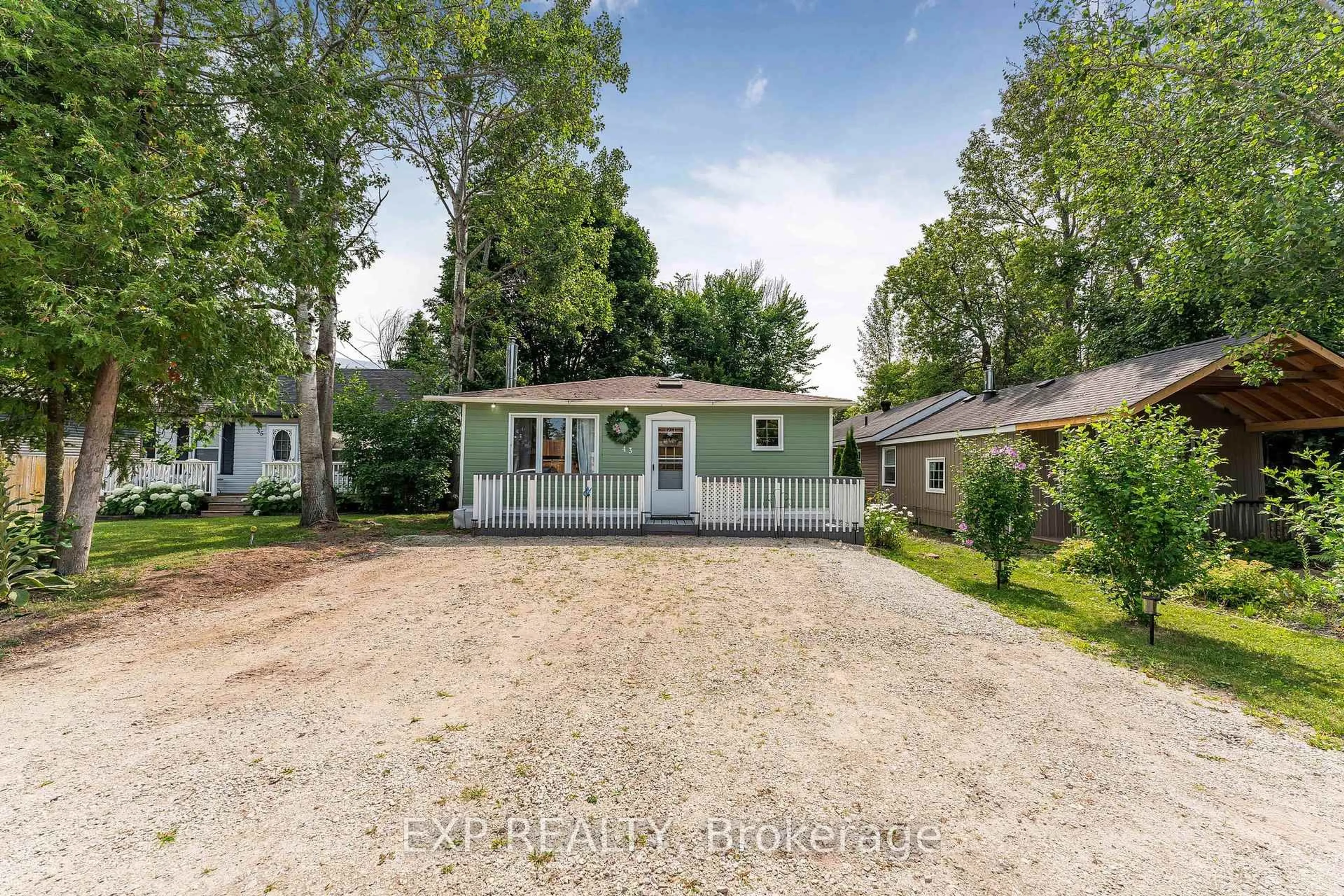 A pic from outside/outdoor area/front of a property/back of a property/a pic from drone, street for 43 68th St, Wasaga Beach Ontario L9Z 1Y1