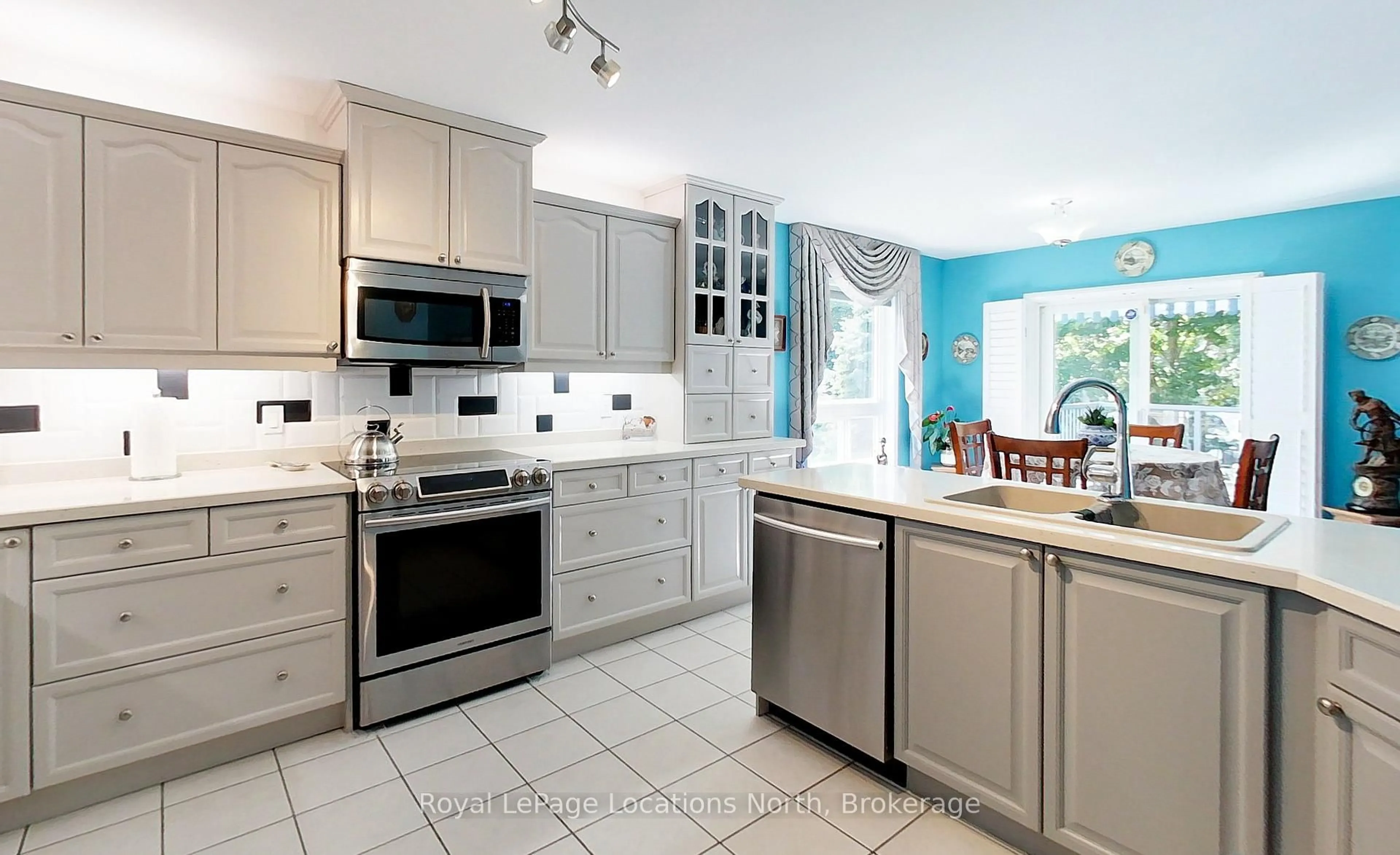 Open concept kitchen, ceramic/tile floor for 144 Royal Beech Dr, Wasaga Beach Ontario L9Z 2N3