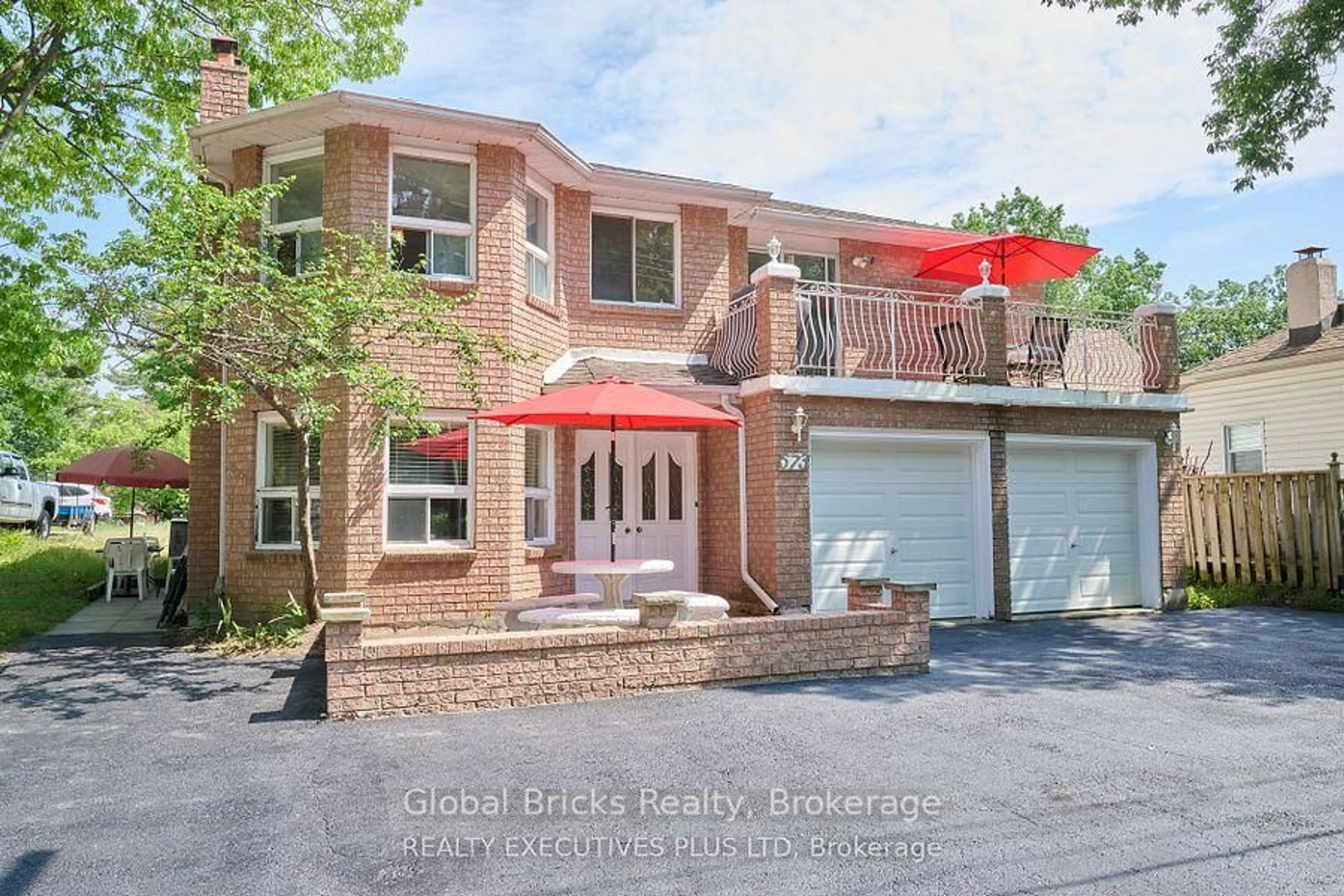 Home with brick exterior material, street for 573 Mosley St, Wasaga Beach Ontario L9Z 2J4