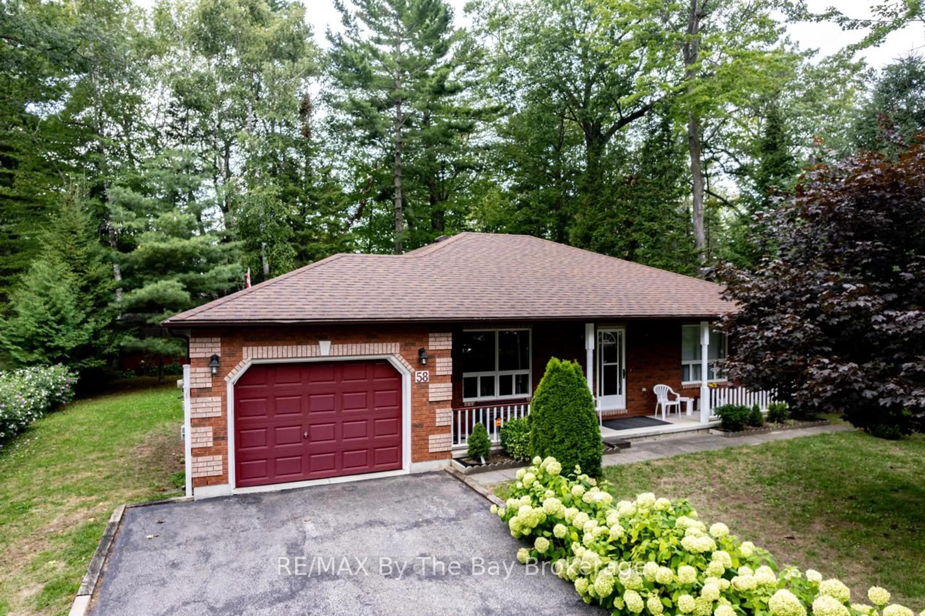 Home with brick exterior material, street for 58 29th St, Wasaga Beach Ontario L9Z 2E1