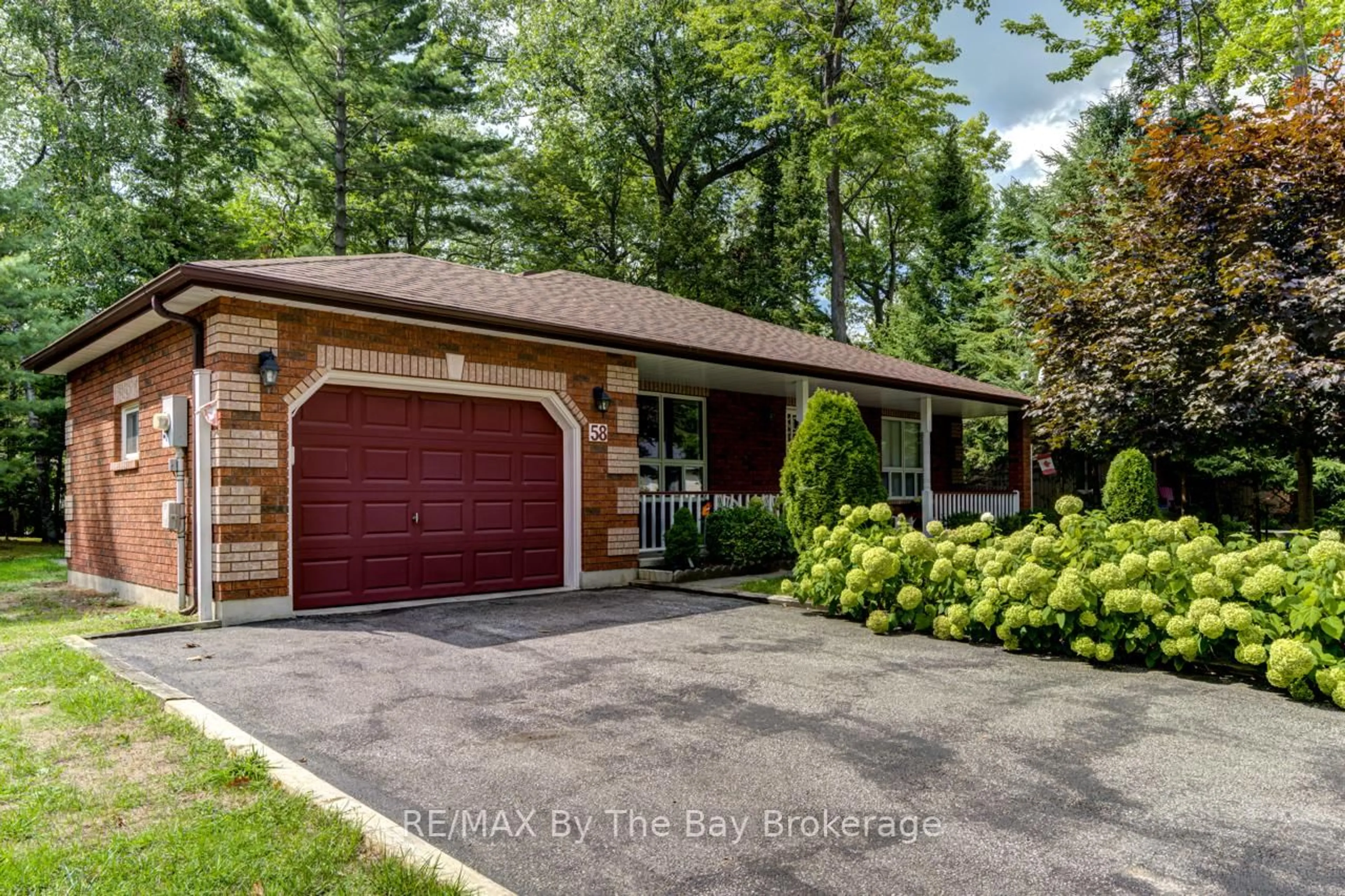 Home with brick exterior material, street for 58 29th St, Wasaga Beach Ontario L9Z 2E1