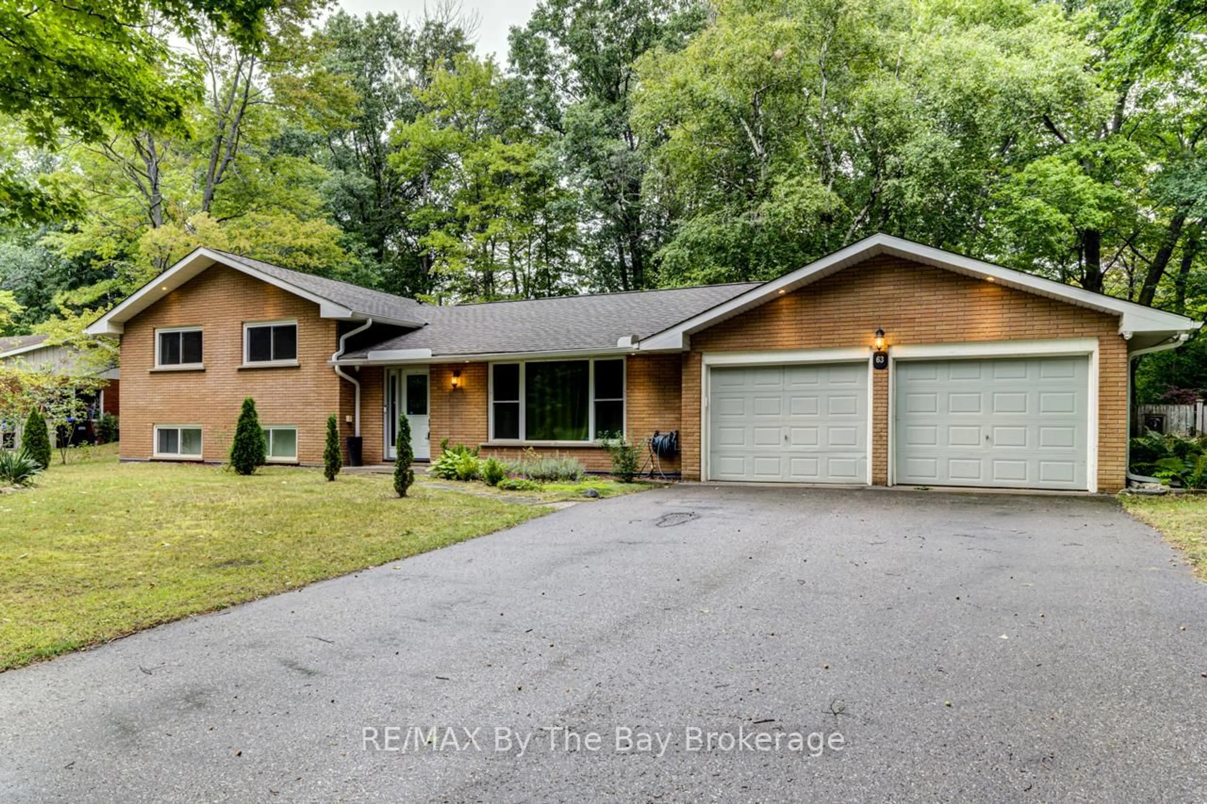 Home with brick exterior material, street for 63 Rodrium Rd, Wasaga Beach Ontario L9Z 1R5