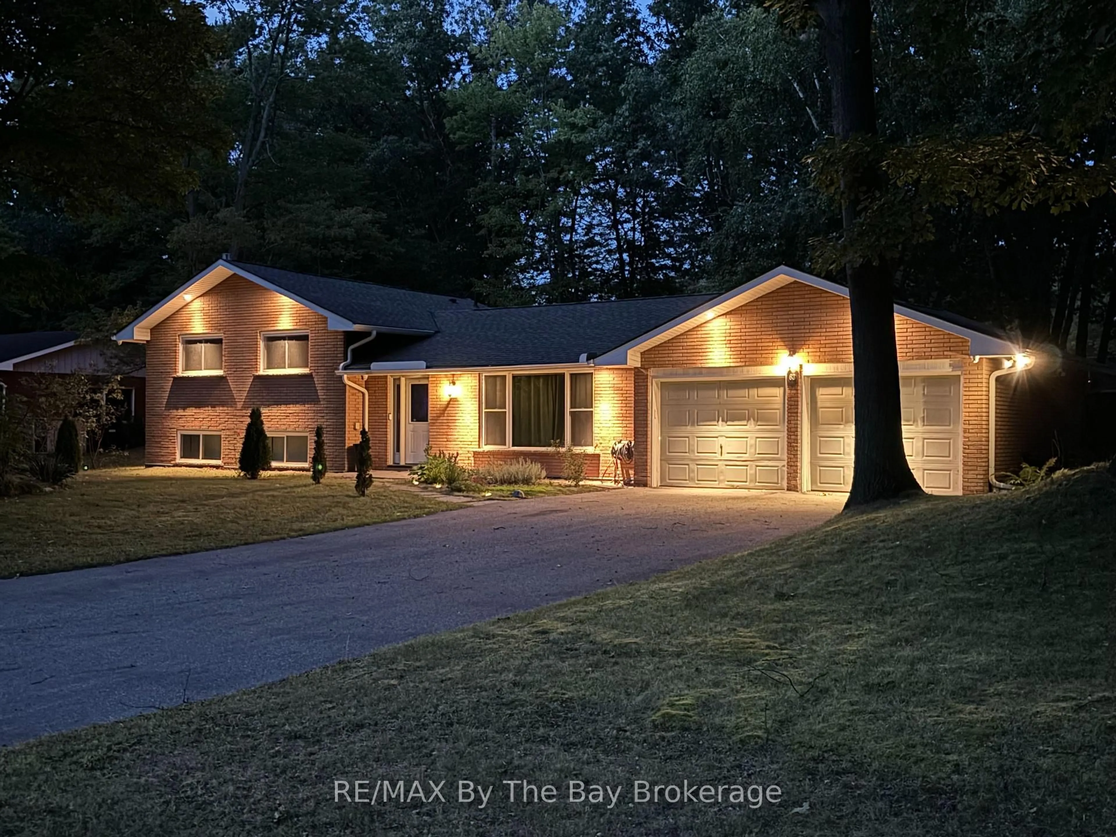 Home with brick exterior material, street for 63 Rodrium Rd, Wasaga Beach Ontario L9Z 1R5