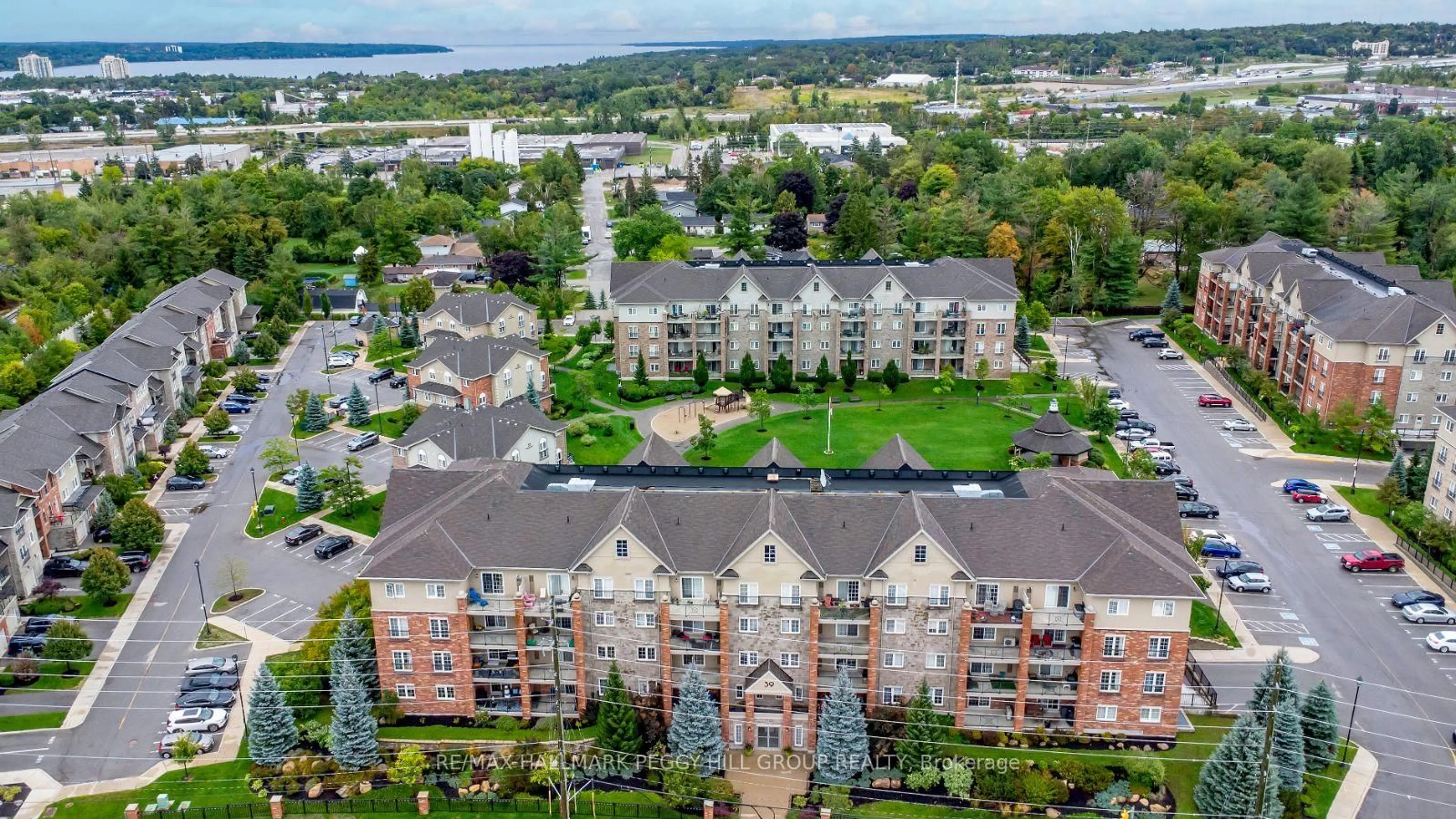 A pic from outside/outdoor area/front of a property/back of a property/a pic from drone, city buildings view from balcony for 39 Ferndale Dr #205, Barrie Ontario L4N 5T5
