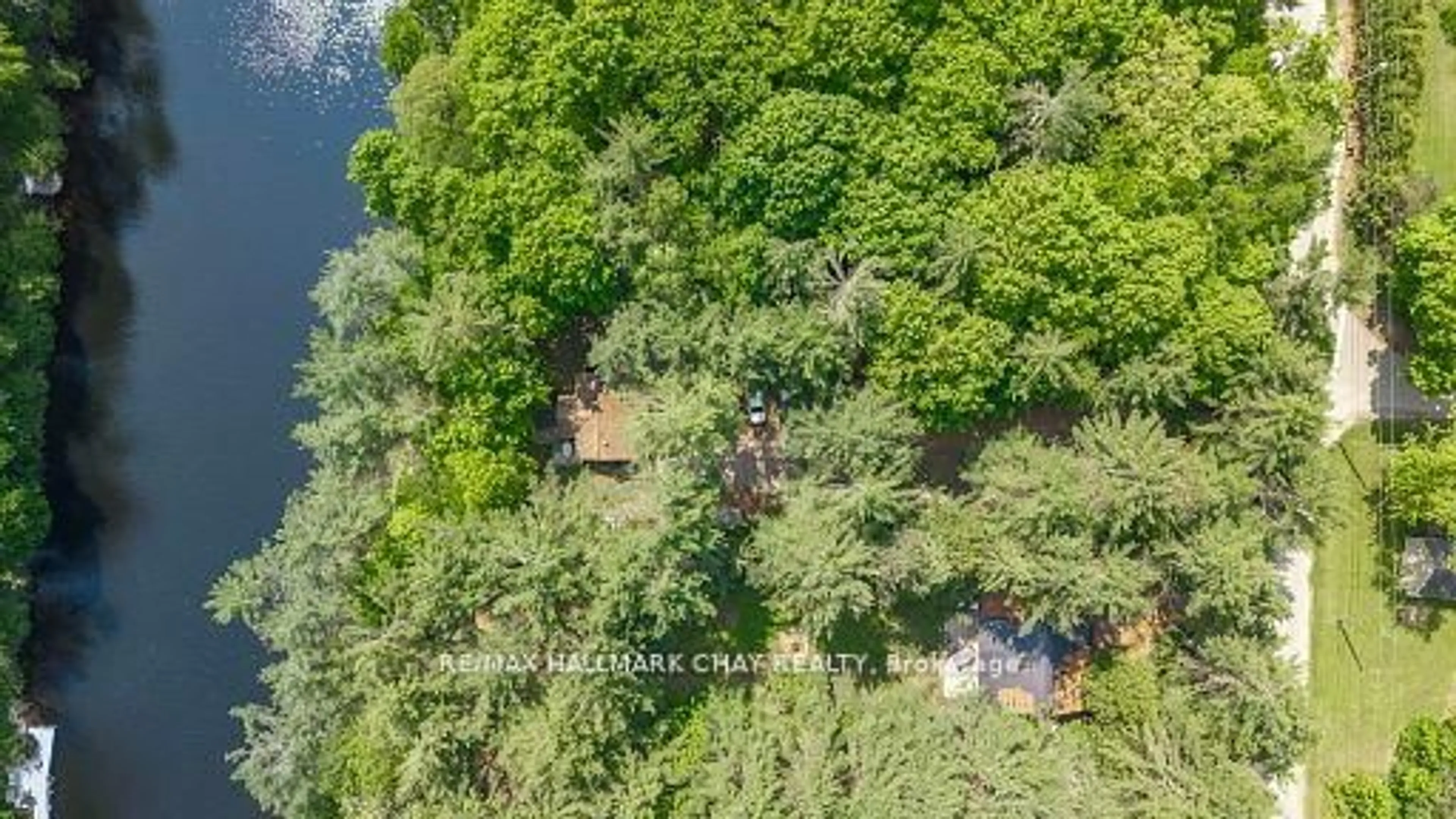 A pic from outside/outdoor area/front of a property/back of a property/a pic from drone, forest/trees view for 4310 Canal Rd, Severn Ontario L0K 2B0