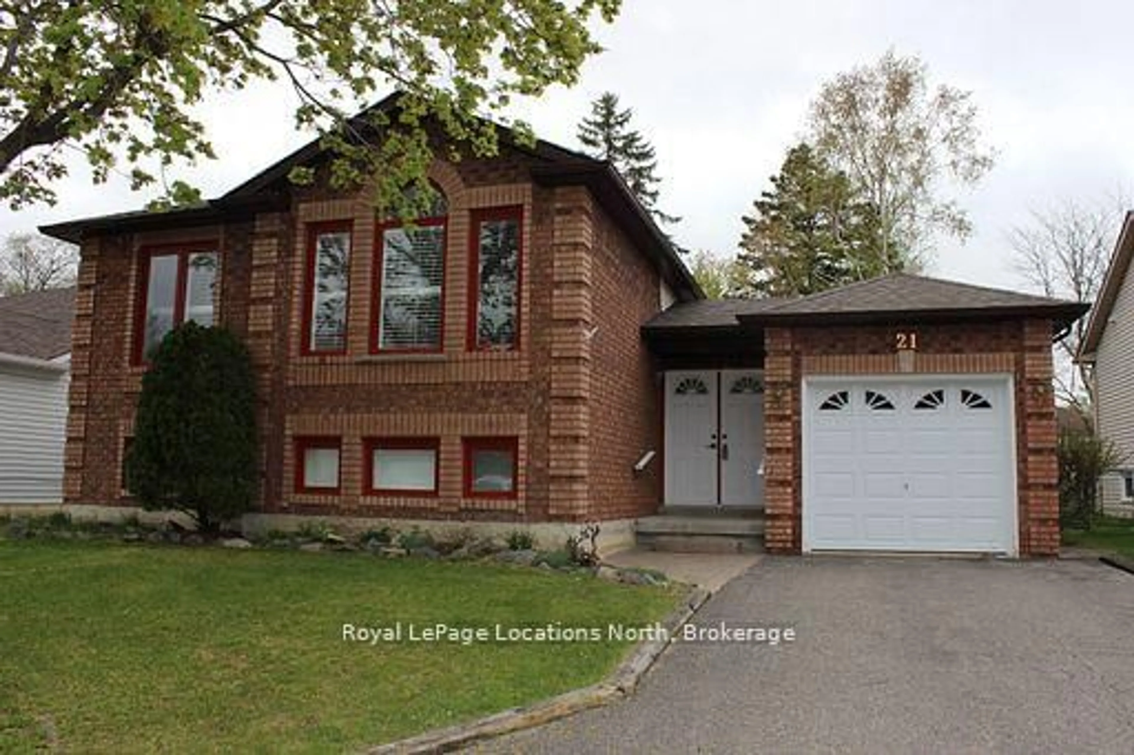 Home with brick exterior material, street for 21 Langevin Dr, Wasaga Beach Ontario L9Z 1C6