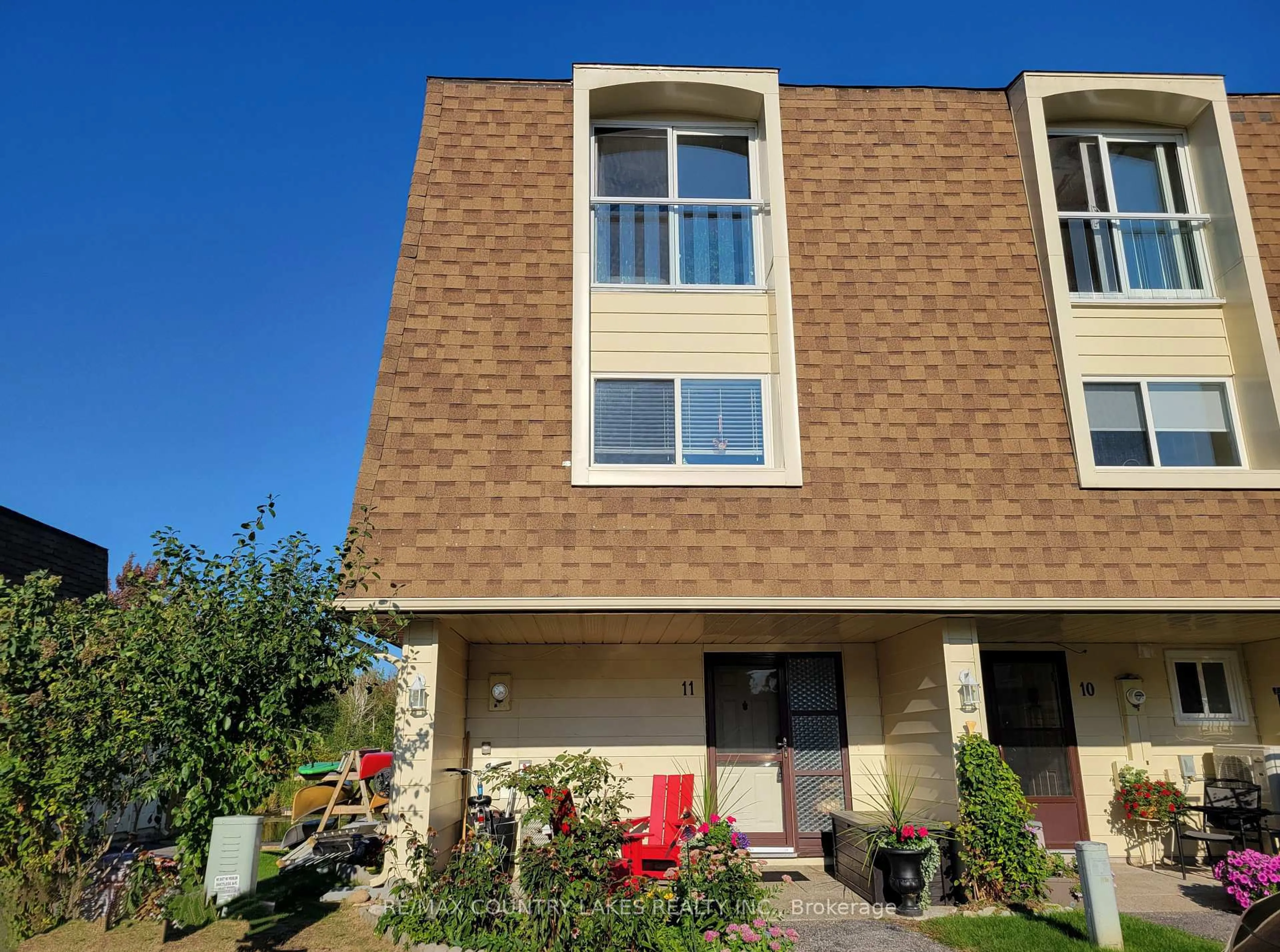 Home with brick exterior material, street for 4 Paradise Blvd #11, Ramara Ontario L0K 1B0