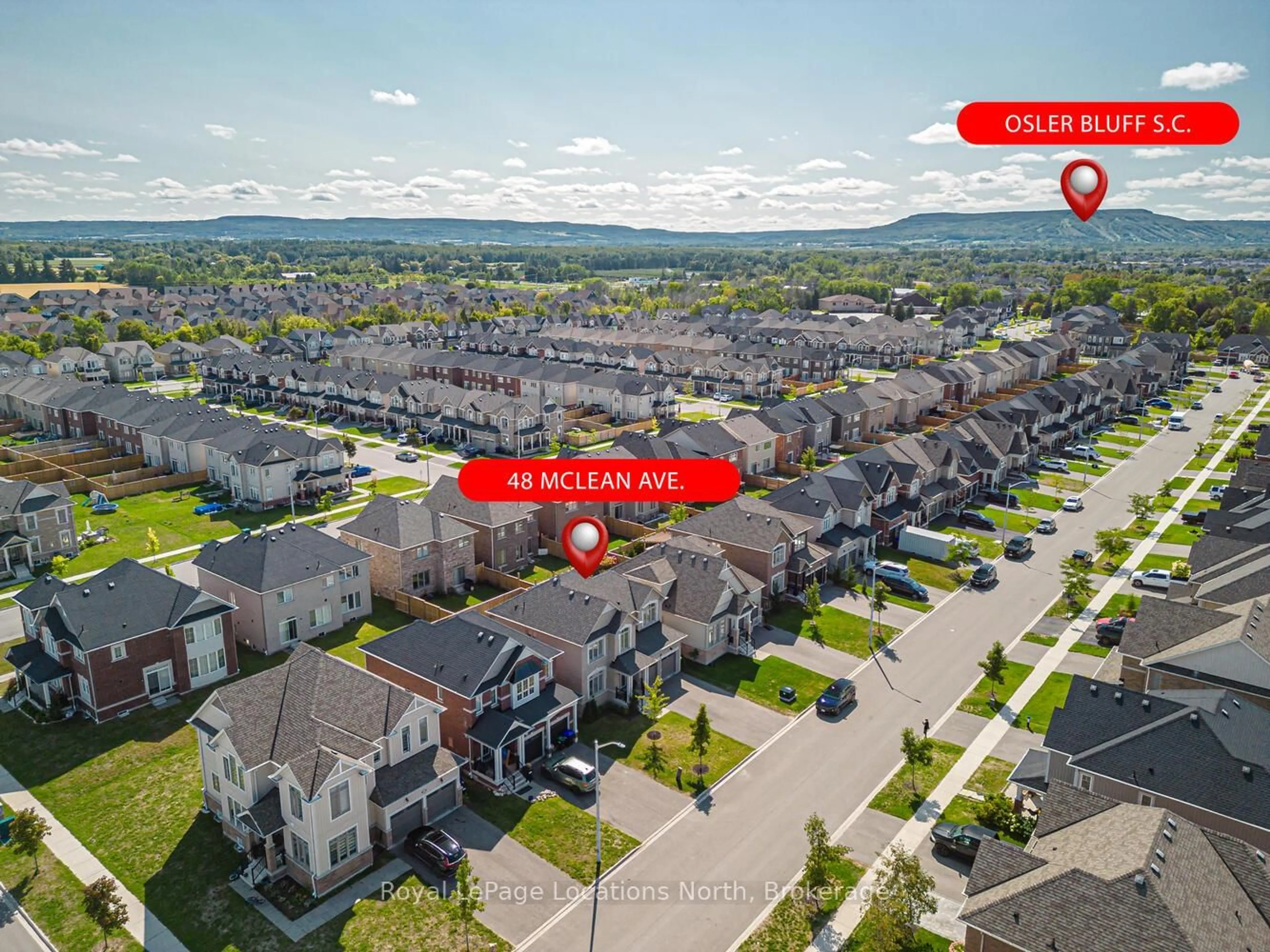 A pic from outside/outdoor area/front of a property/back of a property/a pic from drone, mountain view for 48 Mclean Ave, Collingwood Ontario L9Y 3Z6