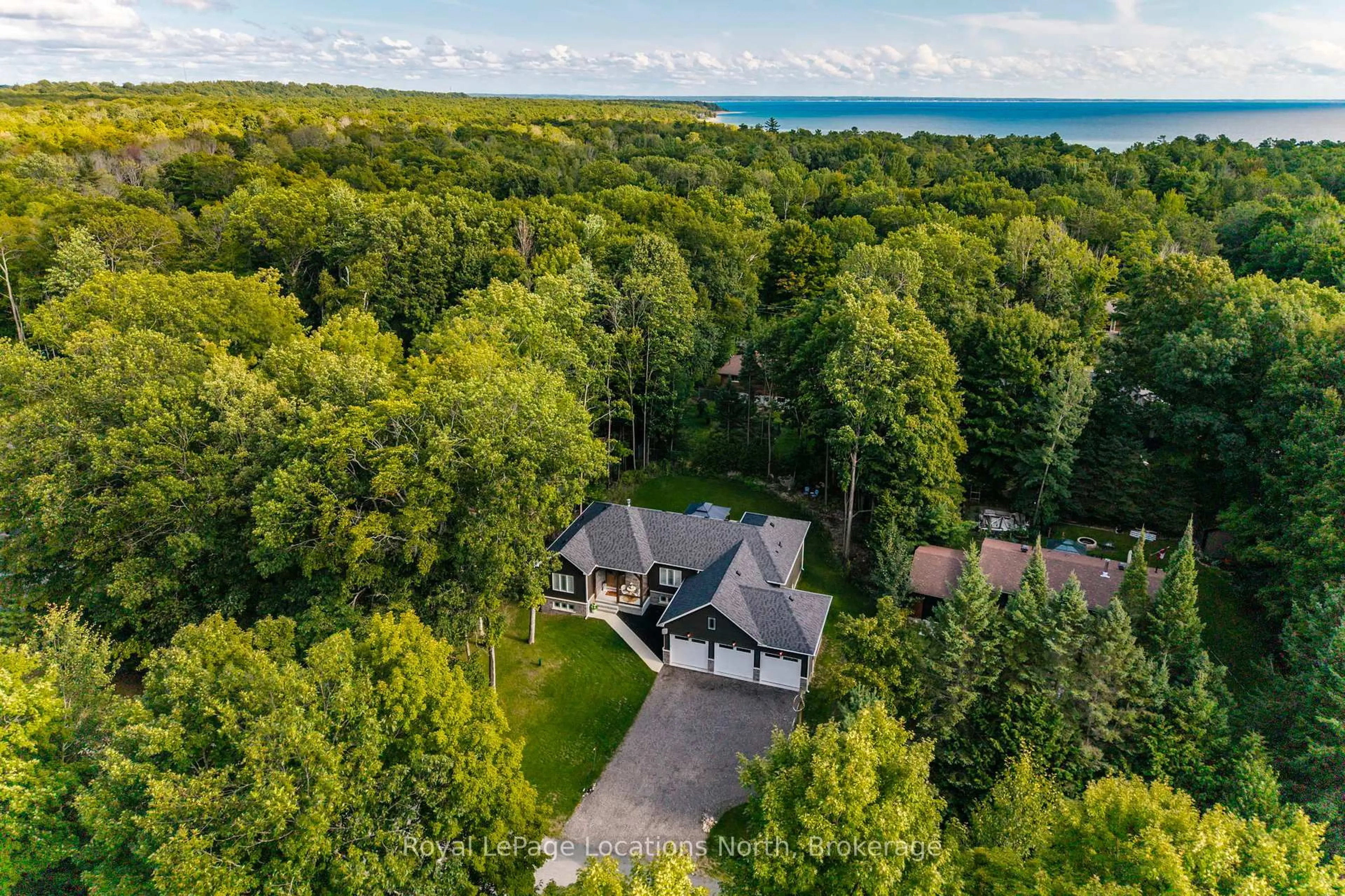 A pic from outside/outdoor area/front of a property/back of a property/a pic from drone, water/lake/river/ocean view for 15 Pinecone Ave, Tiny Ontario L9M 0J2