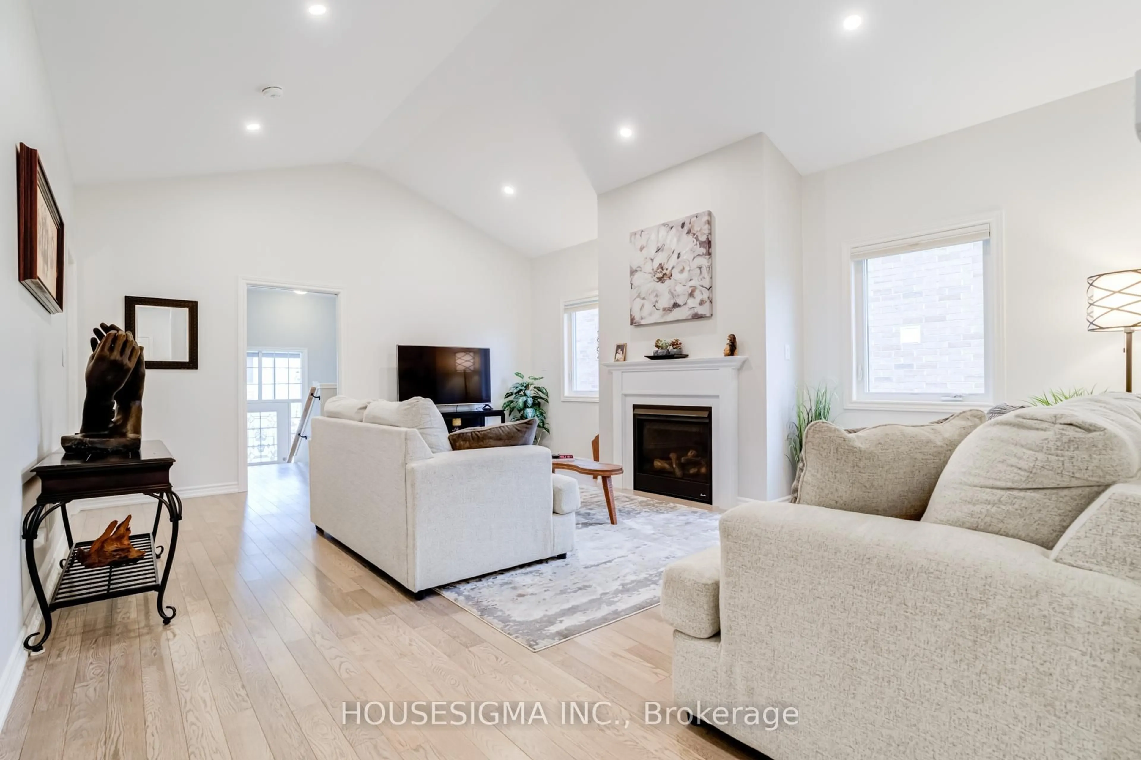Living room with furniture, wood/laminate floor for 208 Breton St, Clearview Ontario L0M 1S0