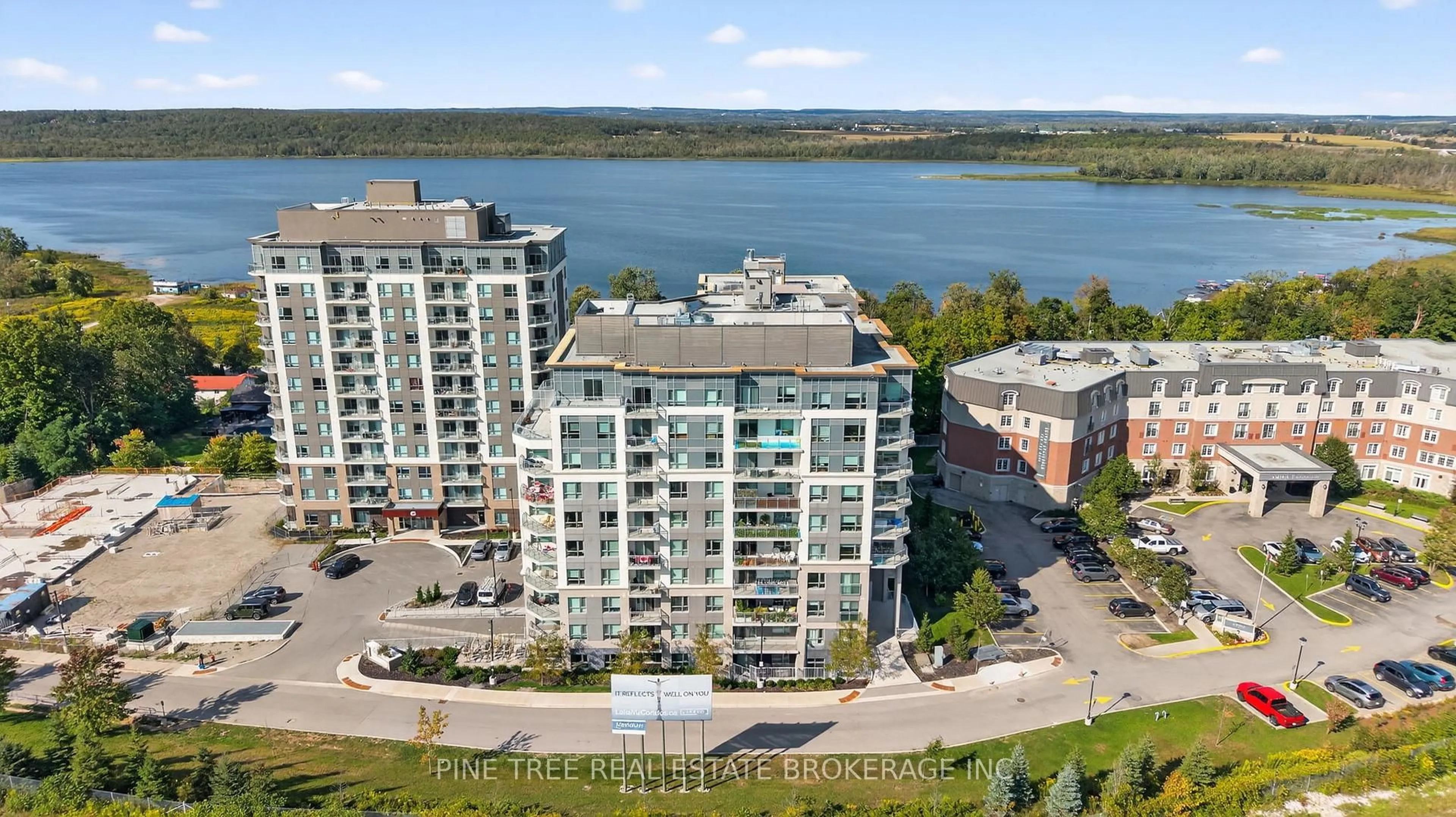 A pic from outside/outdoor area/front of a property/back of a property/a pic from drone, water/lake/river/ocean view for 58 Lakeside Terr #305, Barrie Ontario L0K 1S0