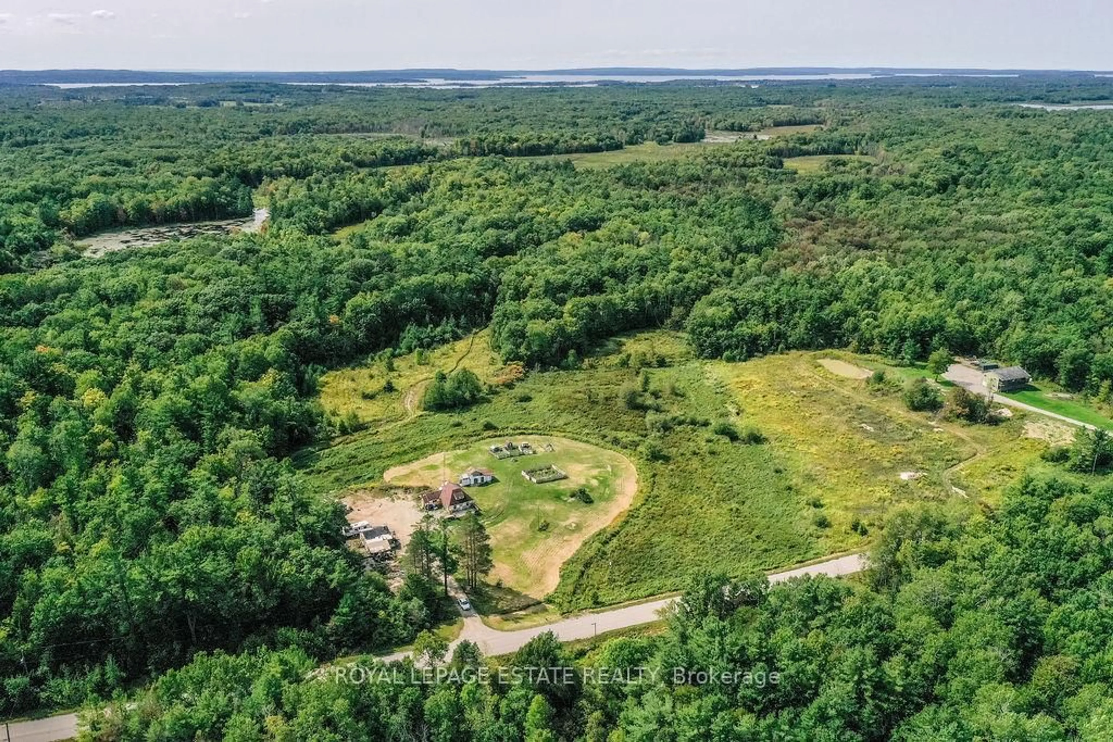 A pic from outside/outdoor area/front of a property/back of a property/a pic from drone, forest/trees view for 2488 Irish Line, Severn Ontario L0K 1E0