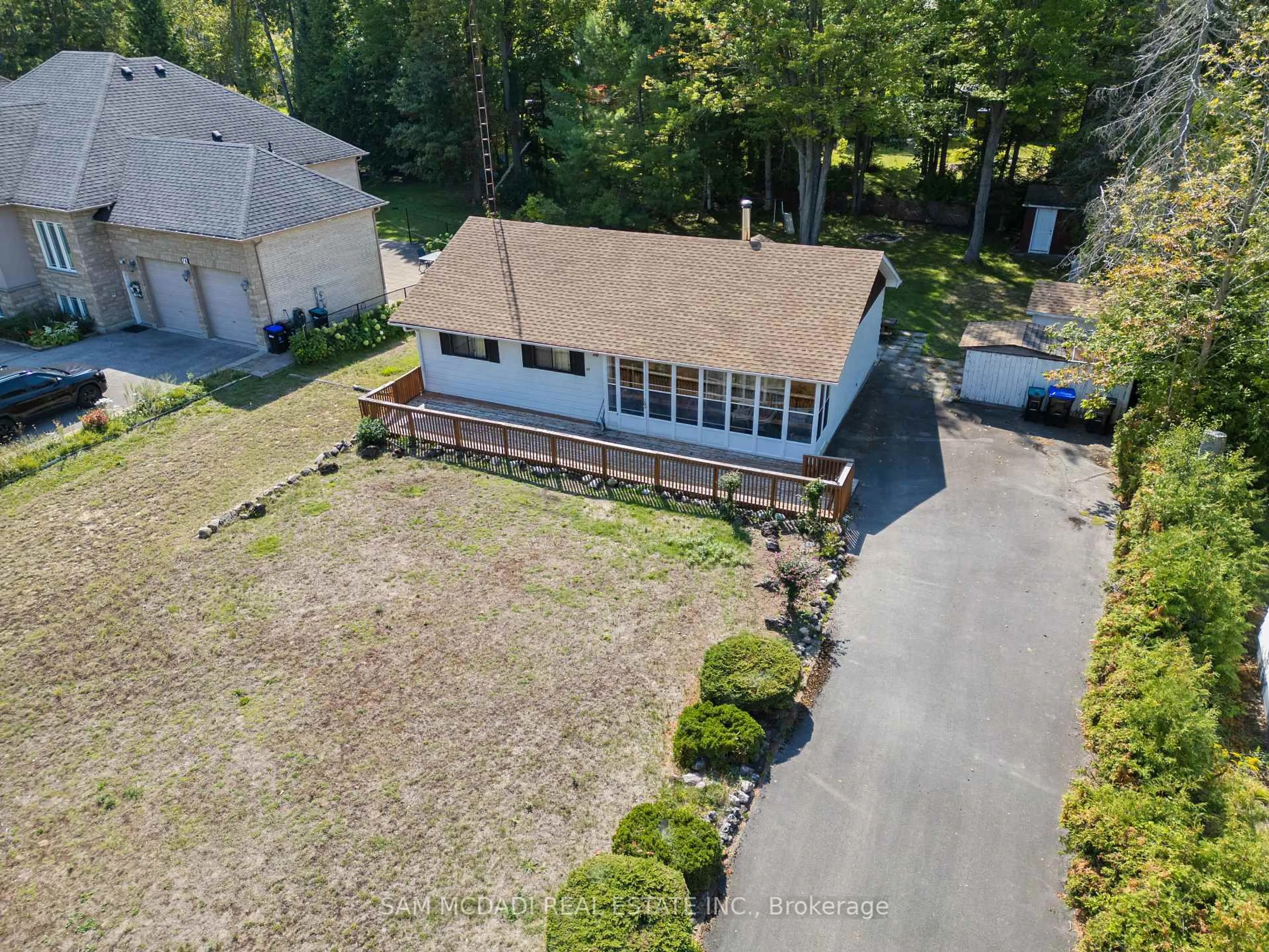A pic from outside/outdoor area/front of a property/back of a property/a pic from drone, unknown for 68 41st St, Wasaga Beach Ontario L9Z 1Z6