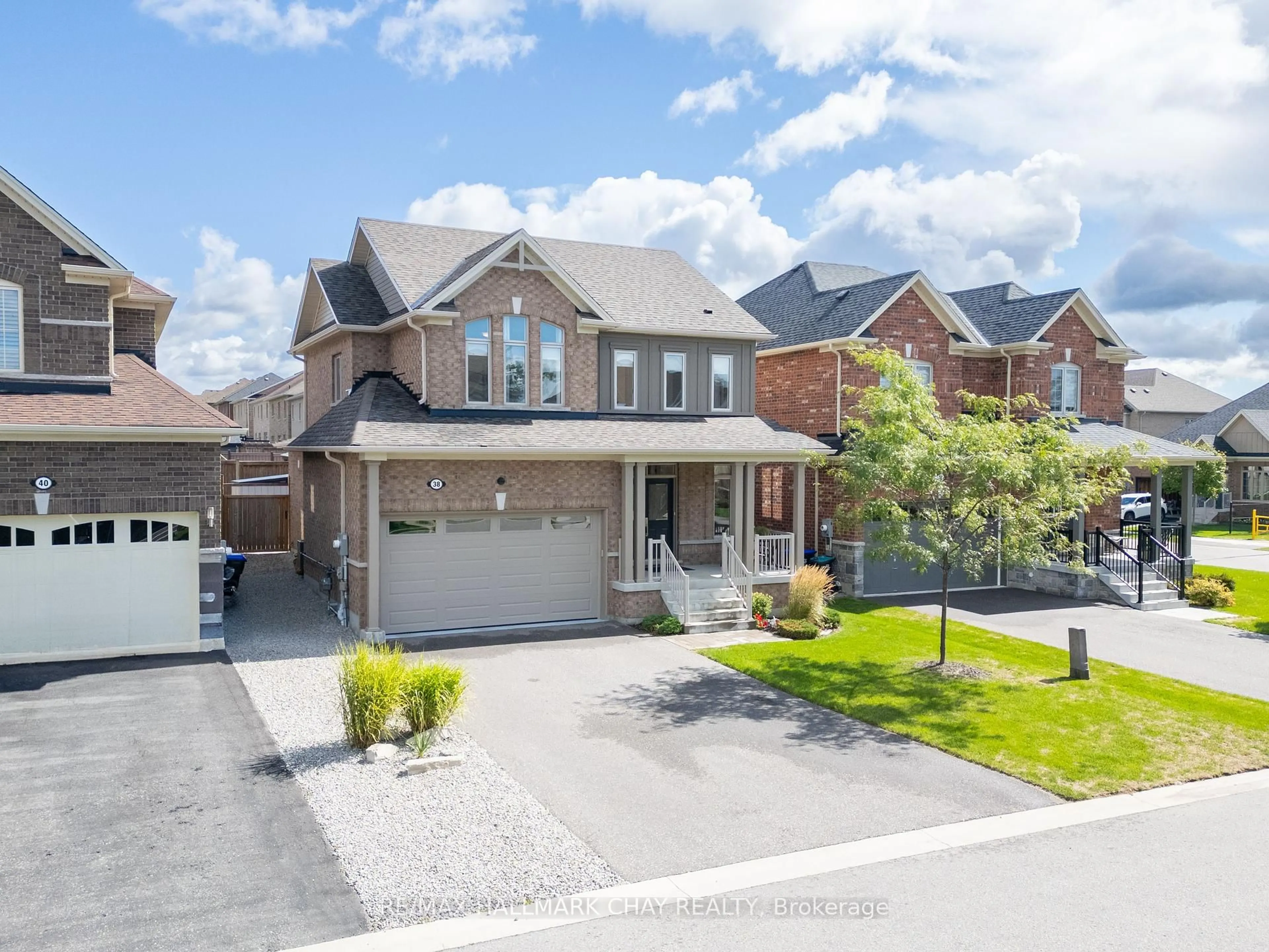Home with brick exterior material, street for 38 Rugman Cres, Springwater Ontario L9X 2A2