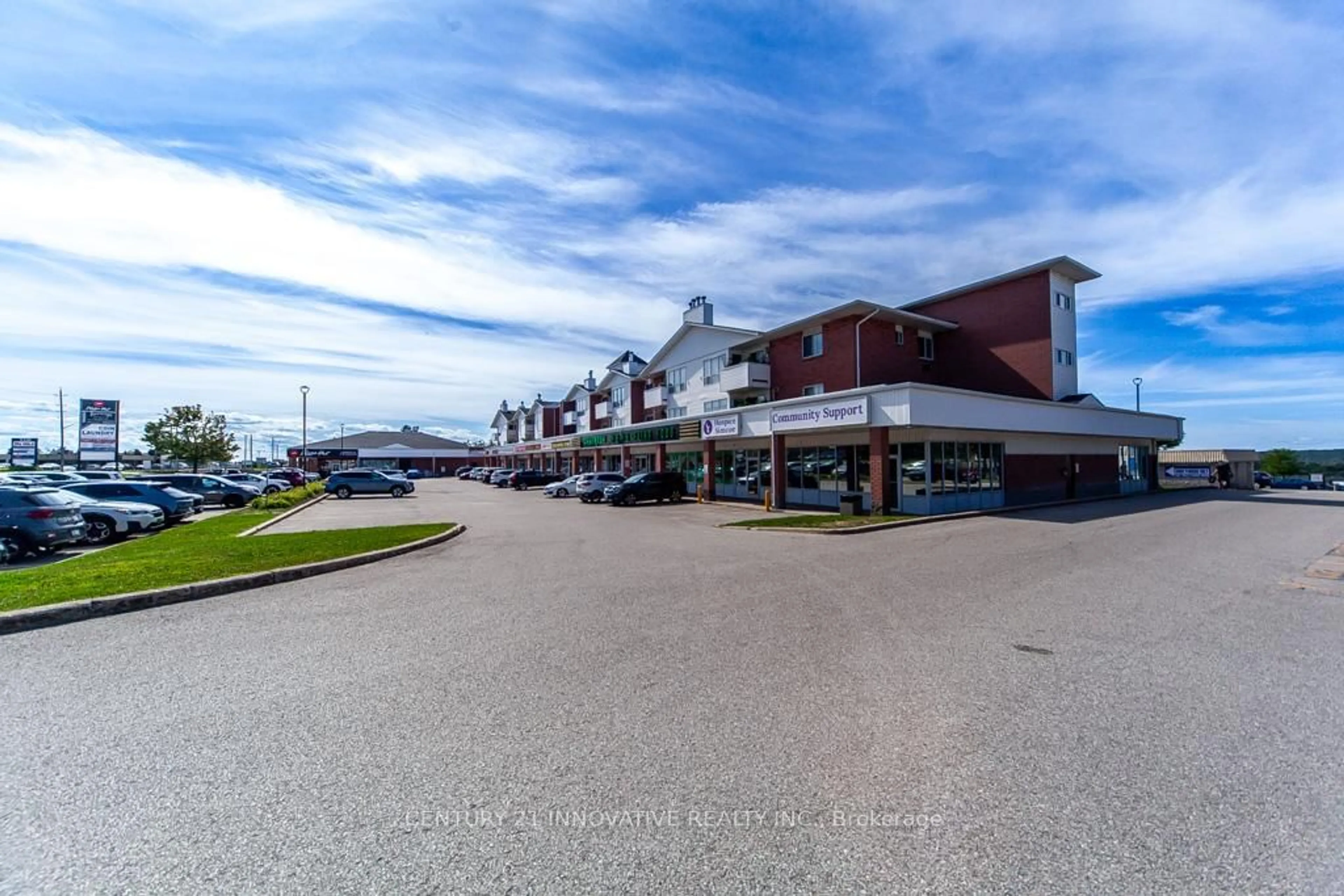 A pic from outside/outdoor area/front of a property/back of a property/a pic from drone, street for 126 Bell Farm Rd #B03, Barrie Ontario L4M 6J3