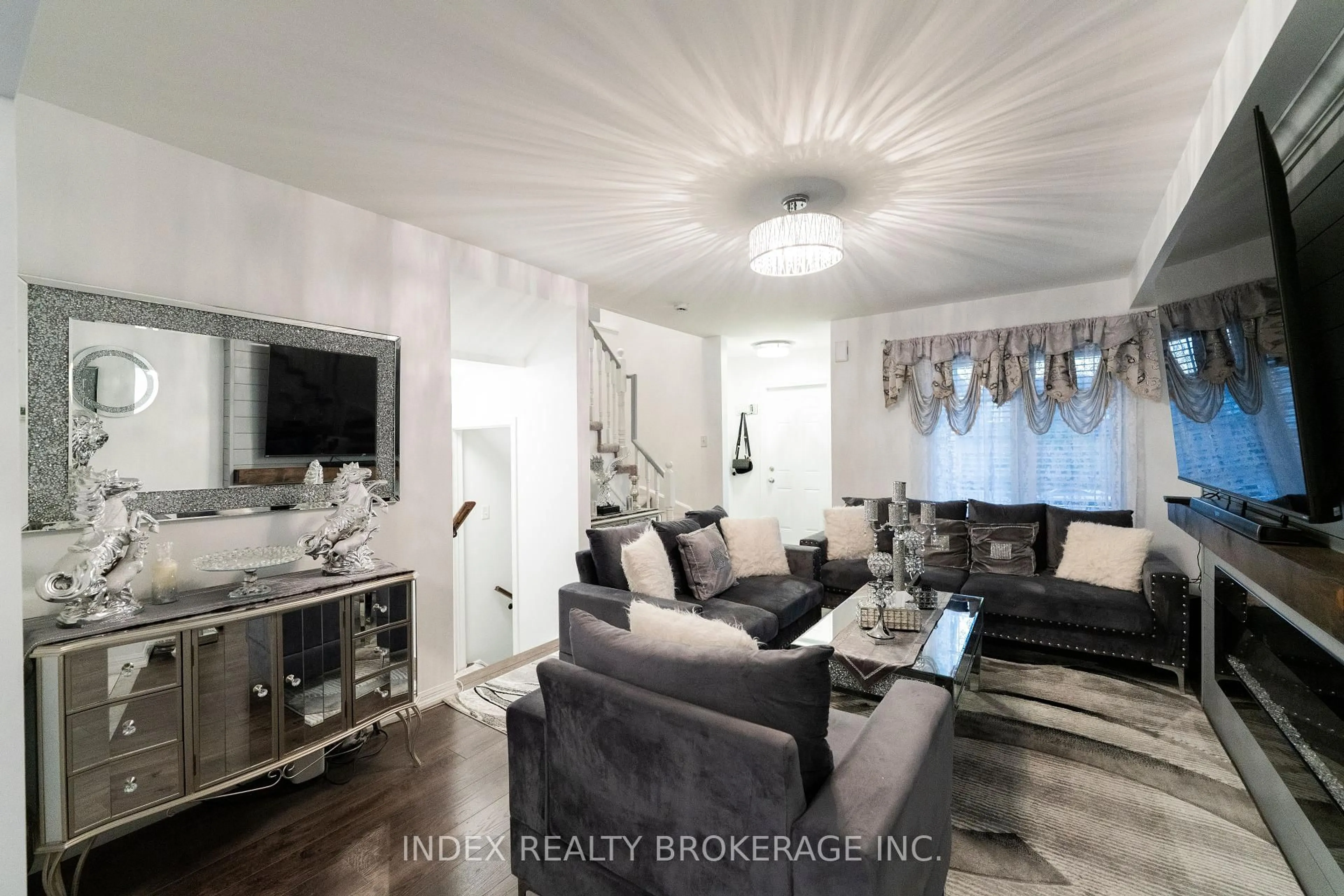 Living room with furniture, wood/laminate floor for 37 Ridwell St, Barrie Ontario L4N 0W8