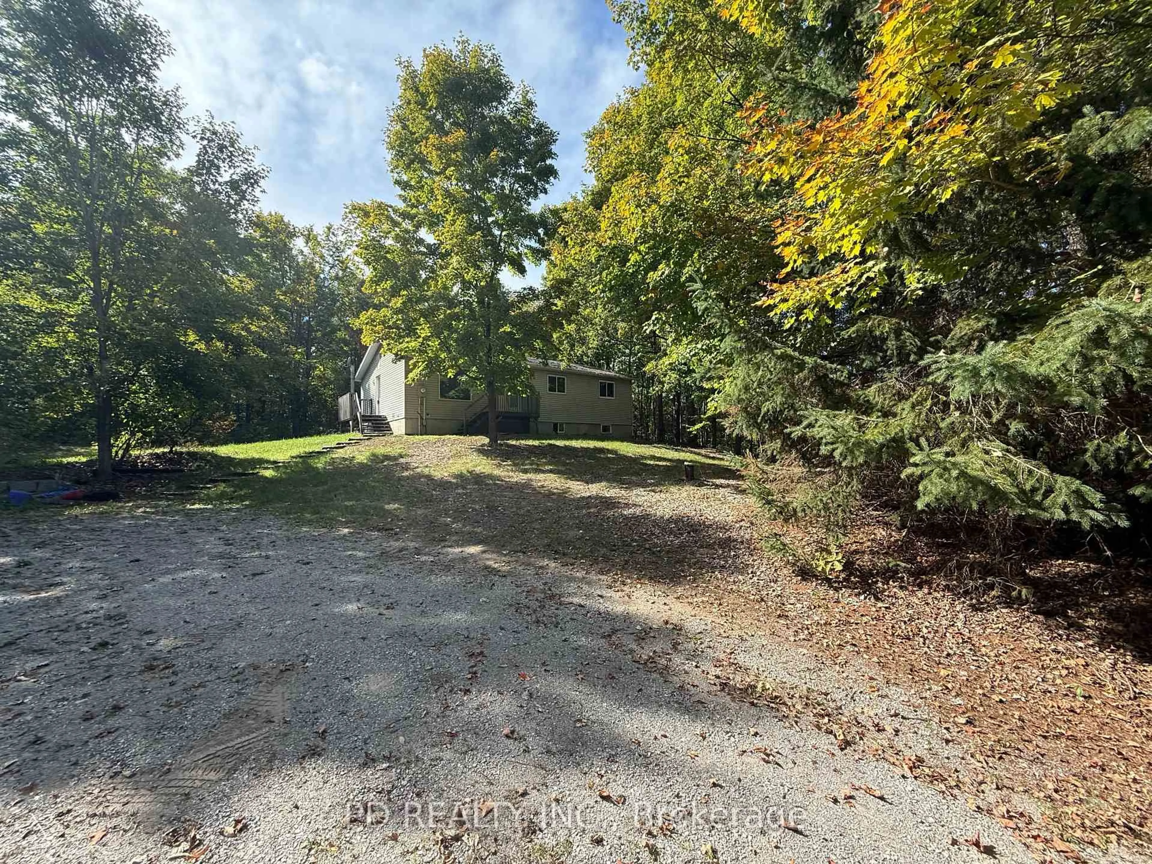 A pic from outside/outdoor area/front of a property/back of a property/a pic from drone, forest/trees view for 5840 Lowanda Lane, Ramara Ontario L0K 1W0