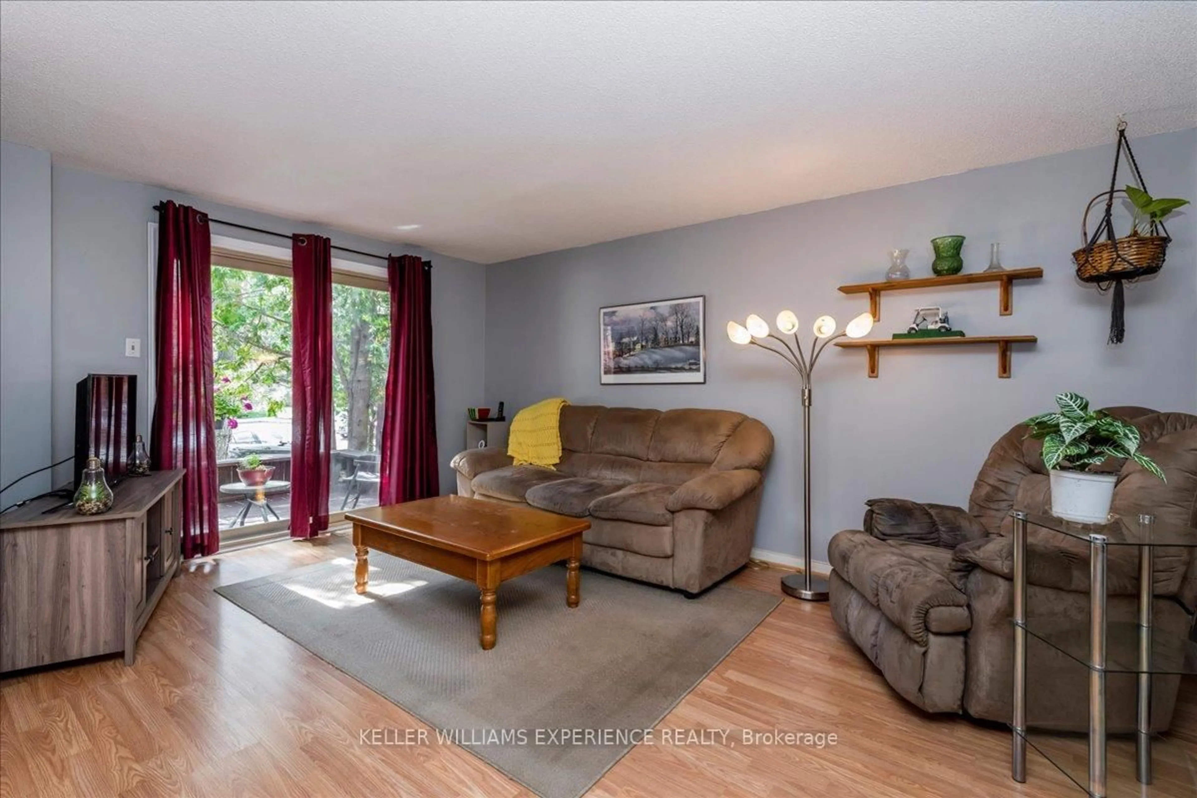 Living room with furniture, wood/laminate floor for 15 Shadowood Rd, Barrie Ontario L4N 7K5
