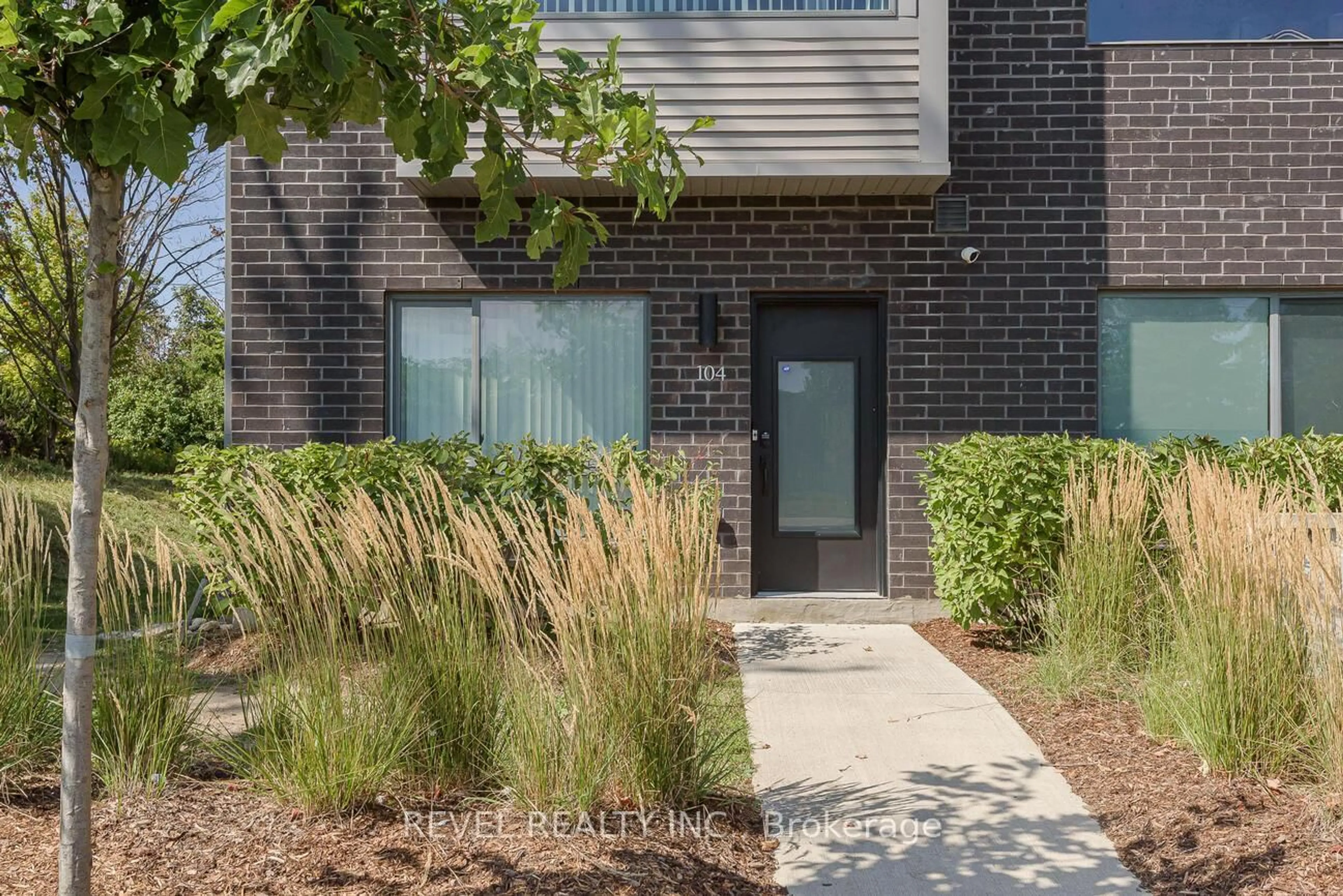 Home with brick exterior material, street for 369 Essa Rd #104, Barrie Ontario L4N 9C8