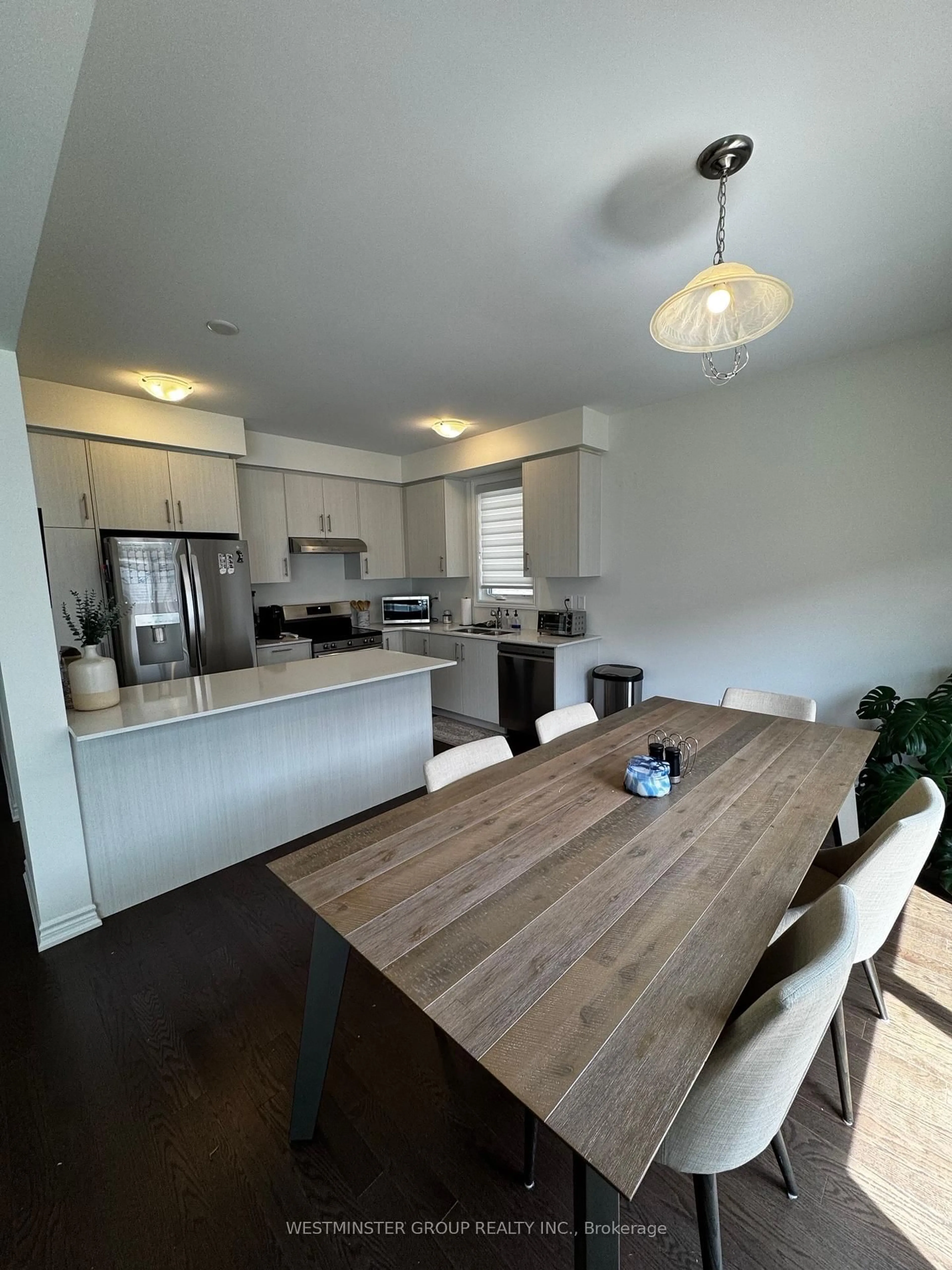 Open concept kitchen, wood/laminate floor for 18 Gemini Dr, Barrie Ontario L9S 2Z4