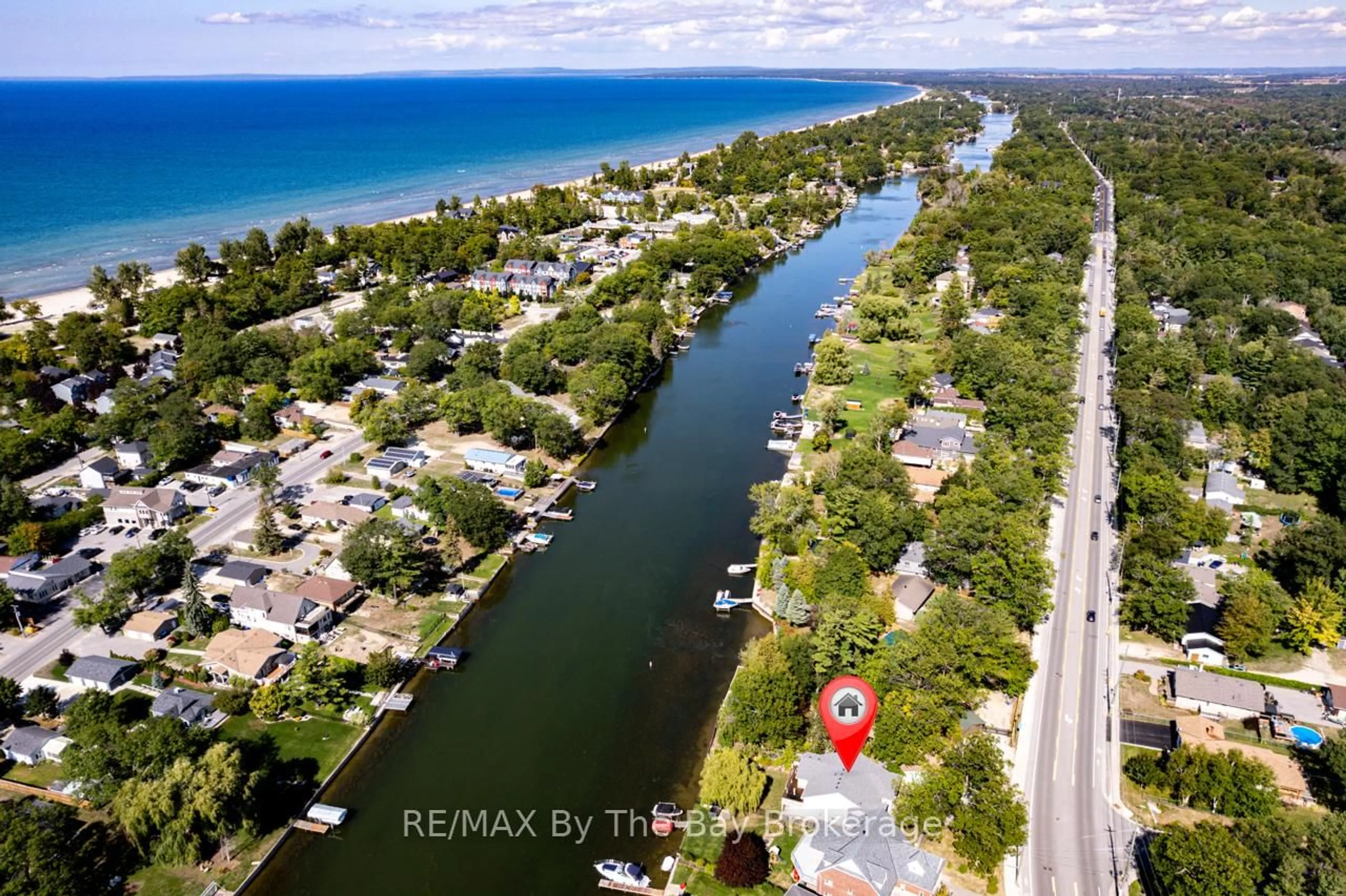 A pic from outside/outdoor area/front of a property/back of a property/a pic from drone, water/lake/river/ocean view for 1902 River Rd, Wasaga Beach Ontario L9Z 2W2
