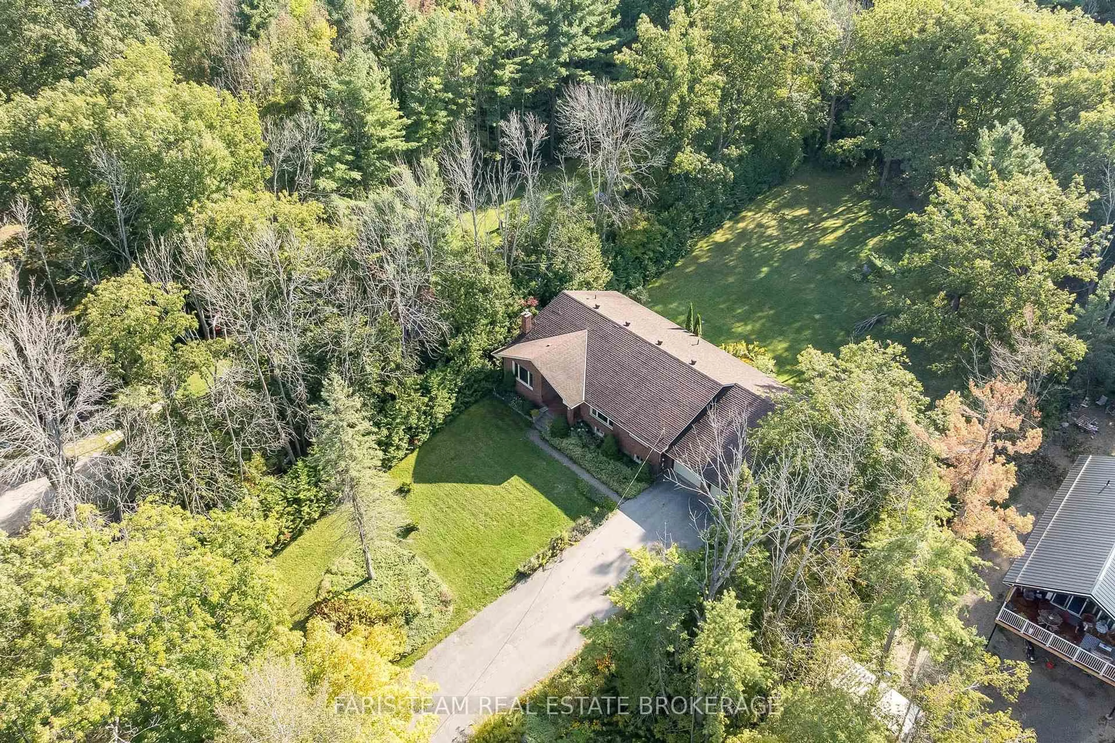 A pic from outside/outdoor area/front of a property/back of a property/a pic from drone, forest/trees view for 2 Bayside Ave, Tay Ontario L0K 2A0