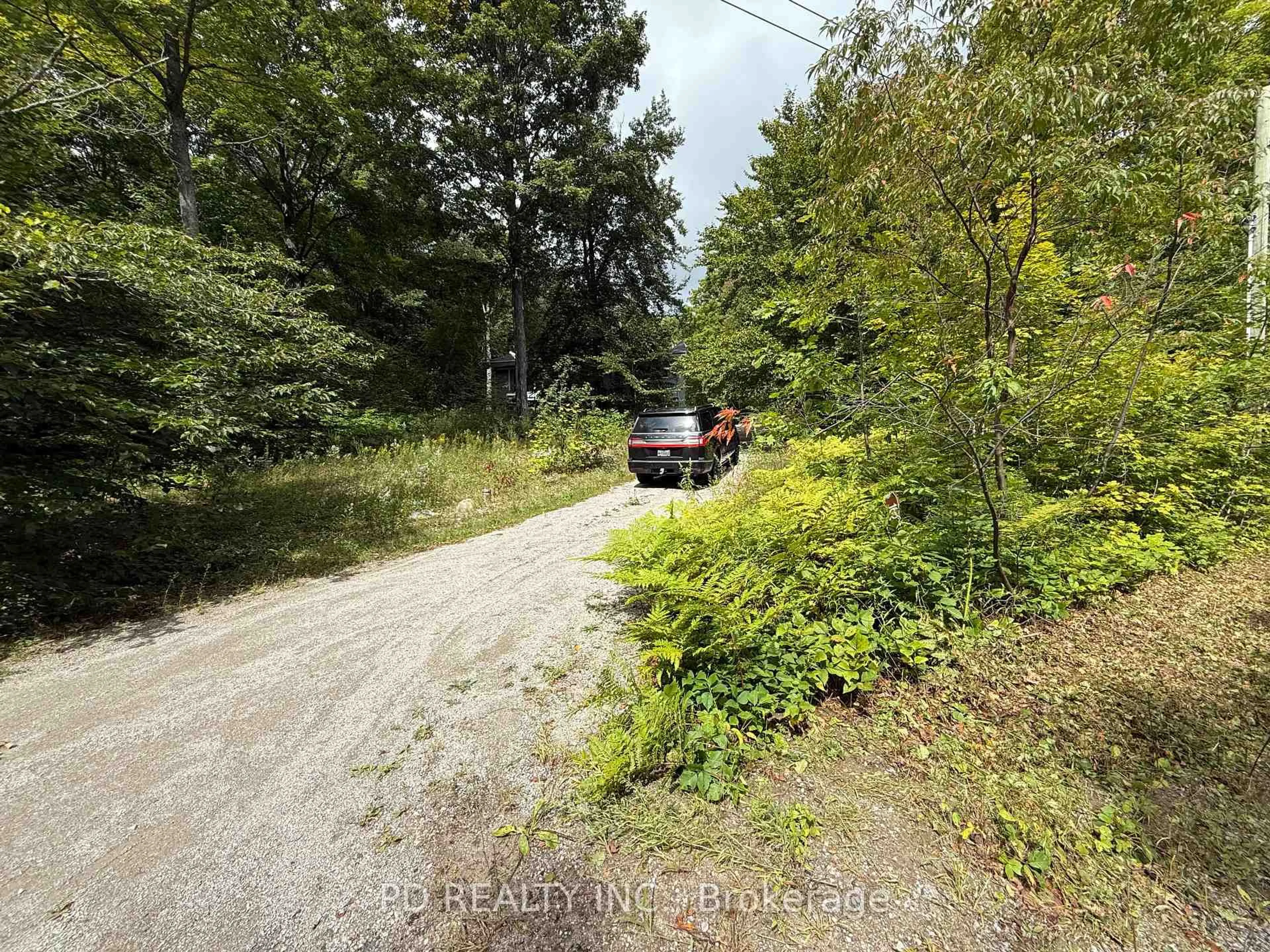 A pic from outside/outdoor area/front of a property/back of a property/a pic from drone, forest/trees view for 162 Farlain Lake Rd, Tiny Ontario L9M 0B9