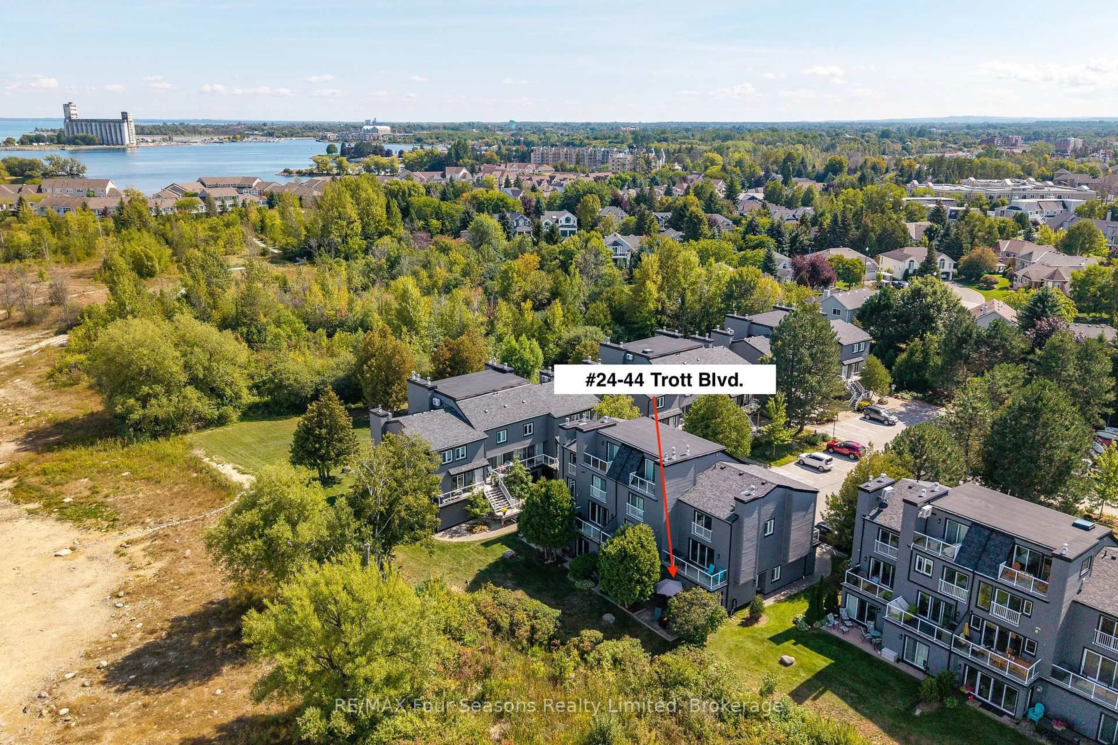 A pic from outside/outdoor area/front of a property/back of a property/a pic from drone, water/lake/river/ocean view for 44 Trott Blvd #24, Collingwood Ontario L9Y 5B7