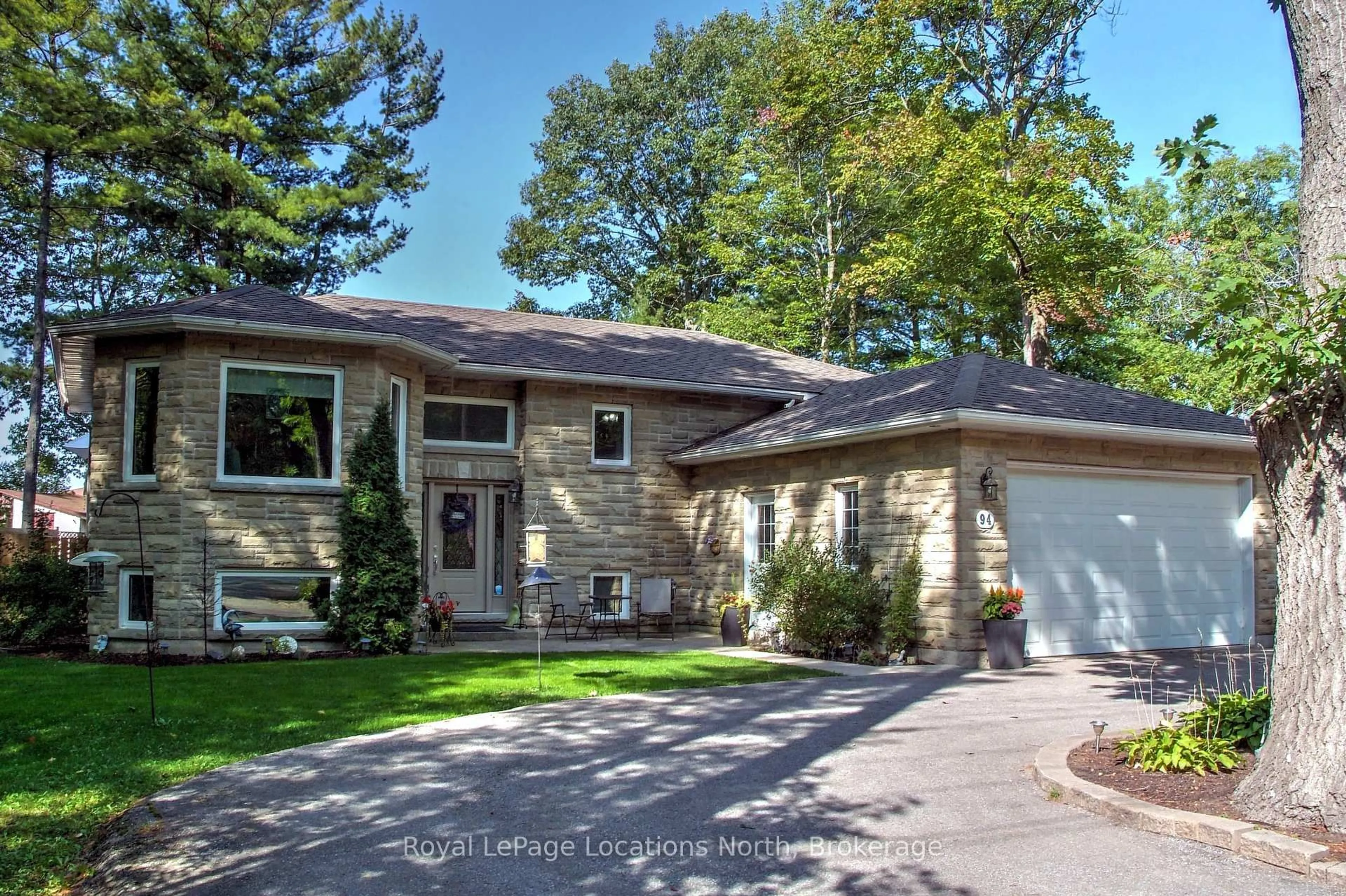 Home with brick exterior material, street for 94 Oxbow Park Dr, Wasaga Beach Ontario L9Z 2V8