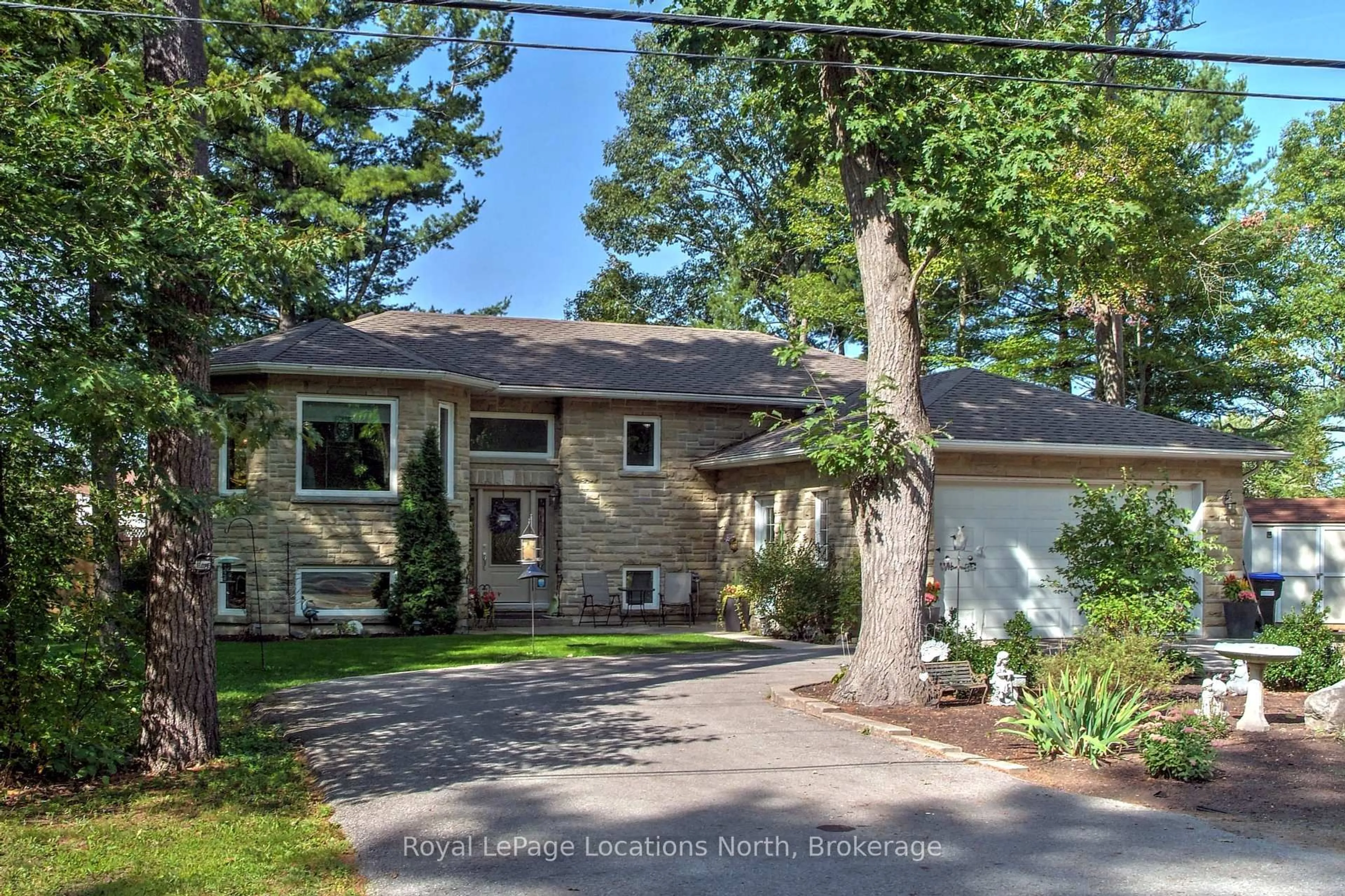 Home with brick exterior material, street for 94 Oxbow Park Dr, Wasaga Beach Ontario L9Z 2V8