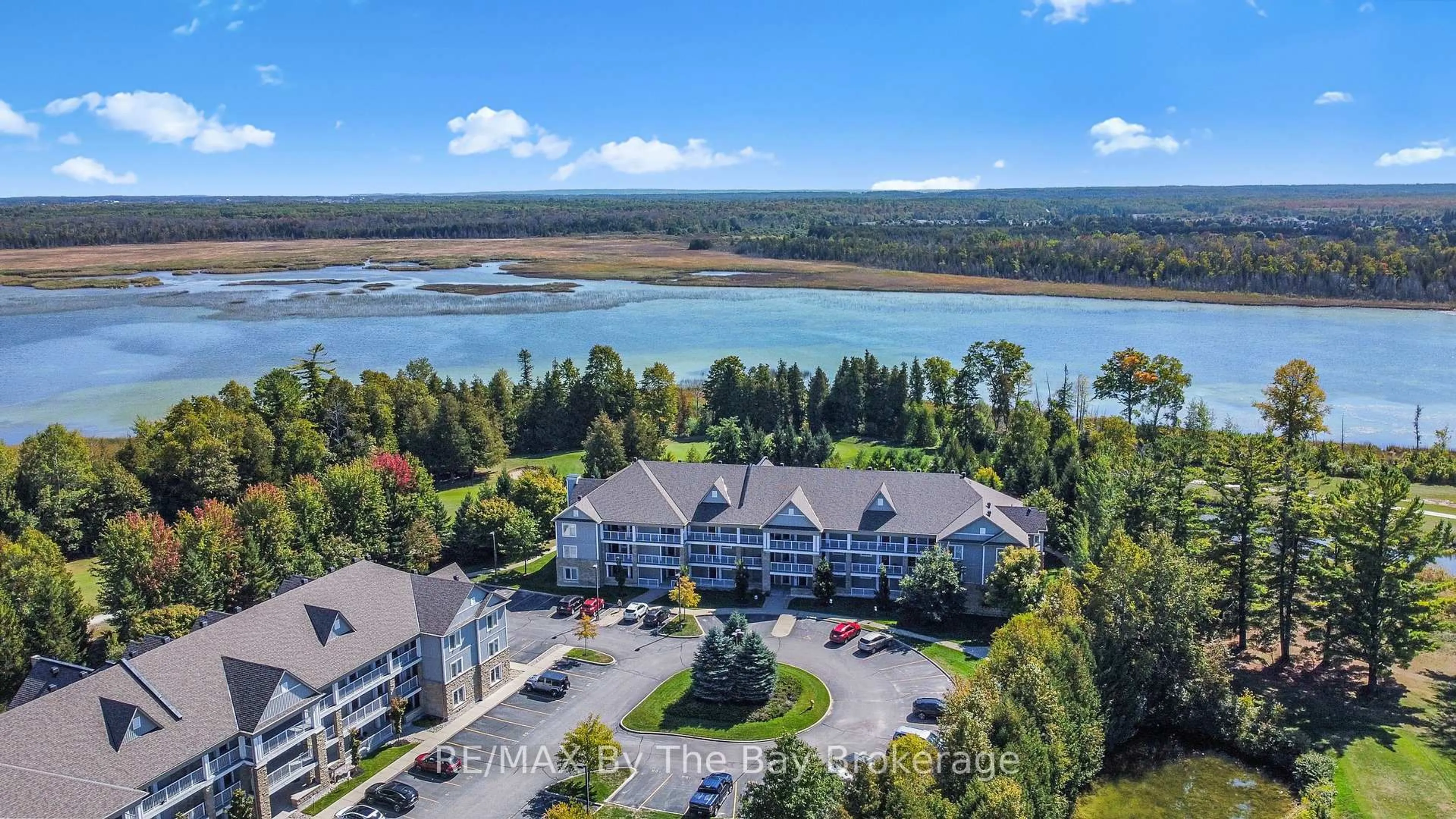A pic from outside/outdoor area/front of a property/back of a property/a pic from drone, water/lake/river/ocean view for 60 Mulligan Lane #121, Wasaga Beach Ontario L9Z 0C5