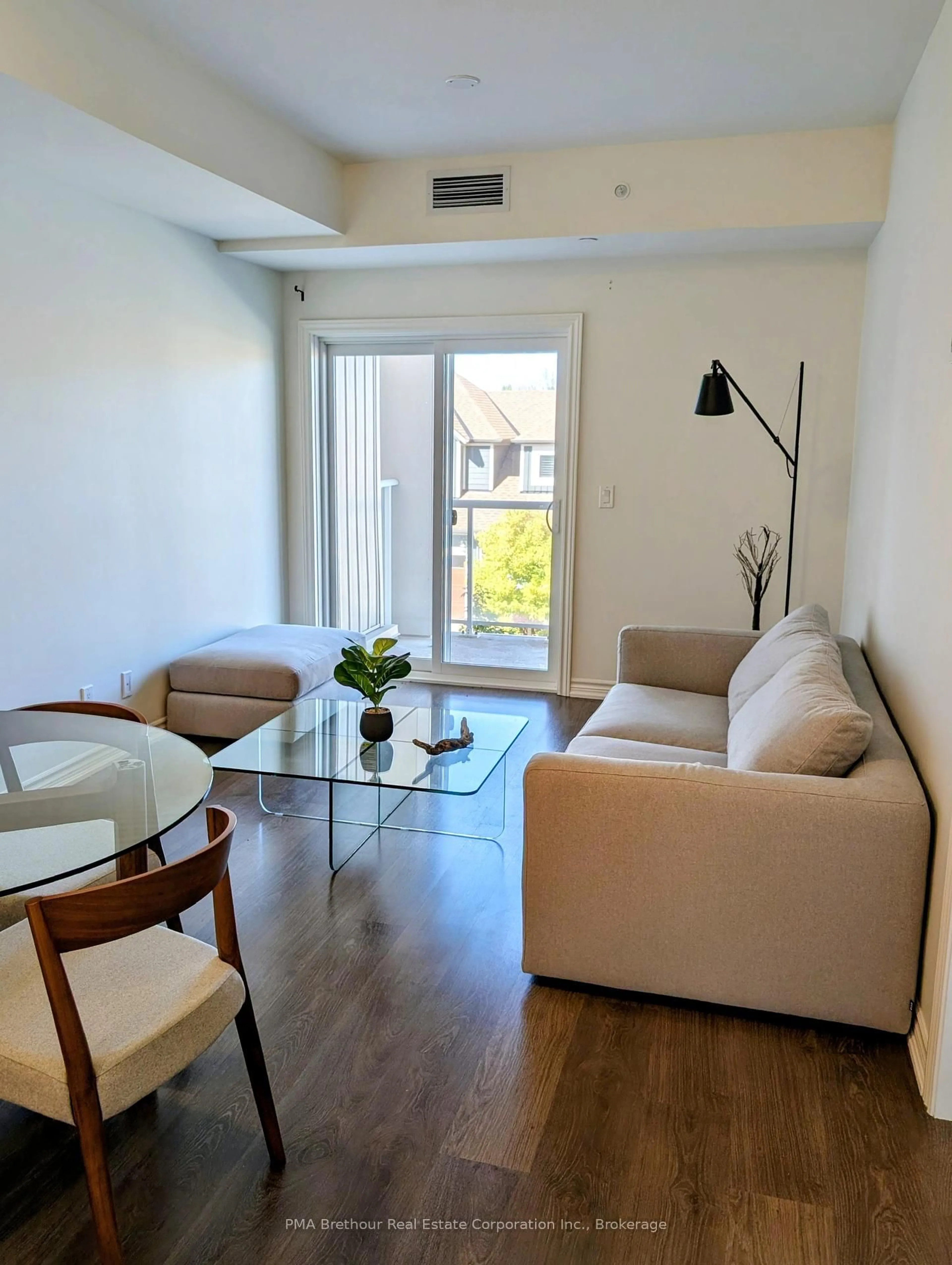 Living room with furniture, wood/laminate floor for 17 Spooner Cres #202, Collingwood Ontario L9Y 1T9