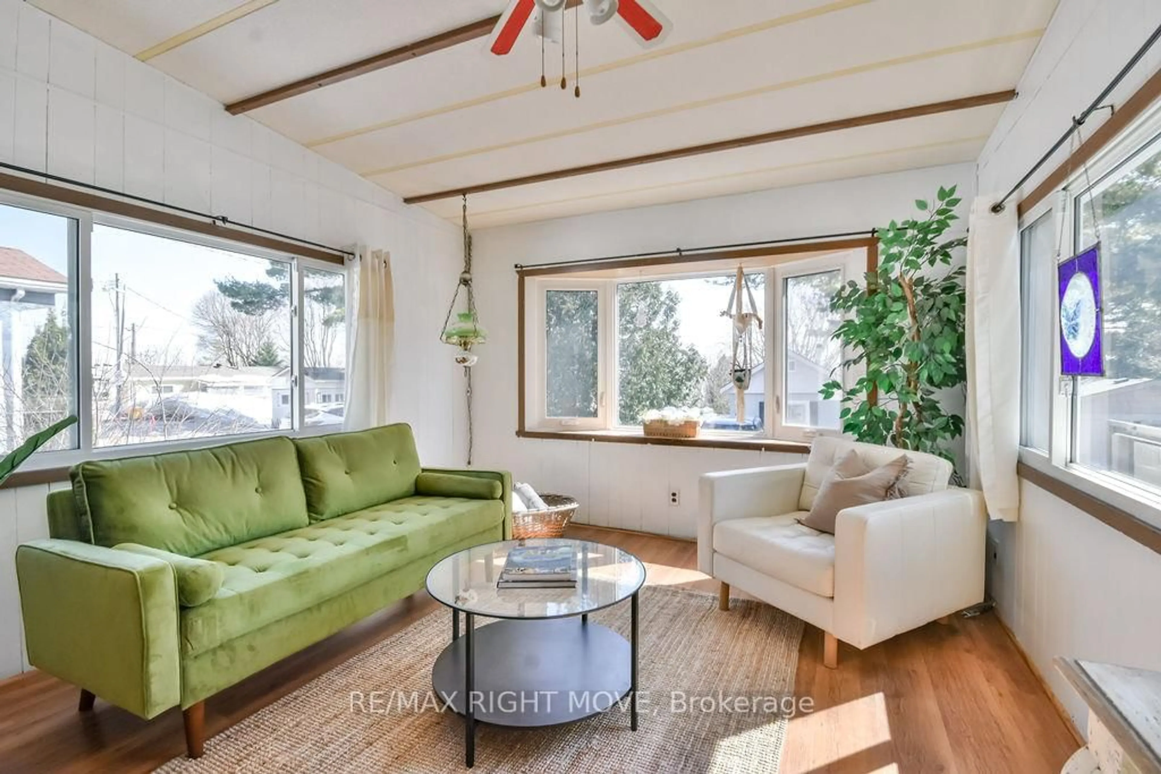 Living room with furniture, wood/laminate floor for 26 Dunn Ave #22, Orillia Ontario L3V 2N9