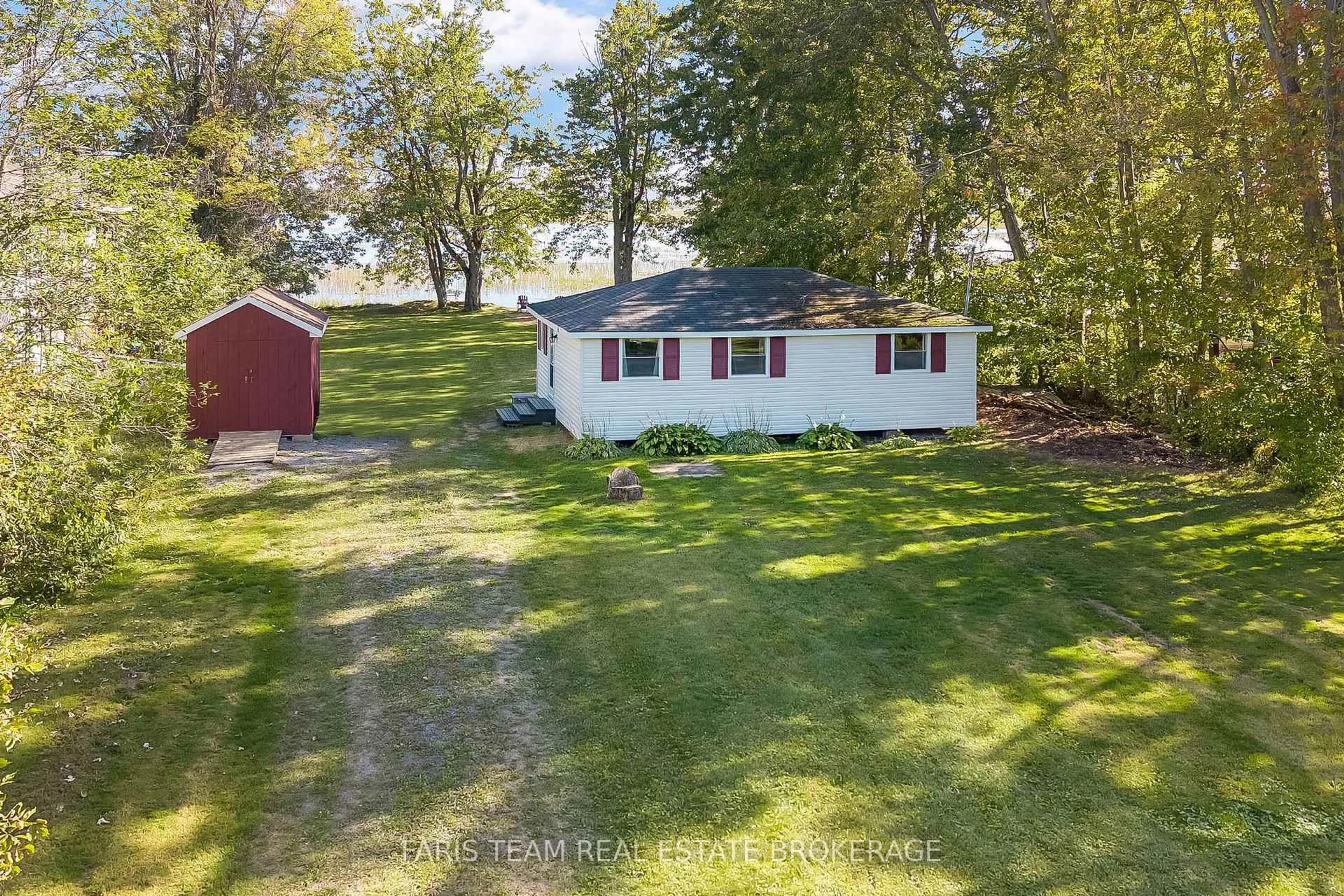 A pic from outside/outdoor area/front of a property/back of a property/a pic from drone, water/lake/river/ocean view for 1313 Carol Ann Ave, Ramara Ontario L0K 1B0