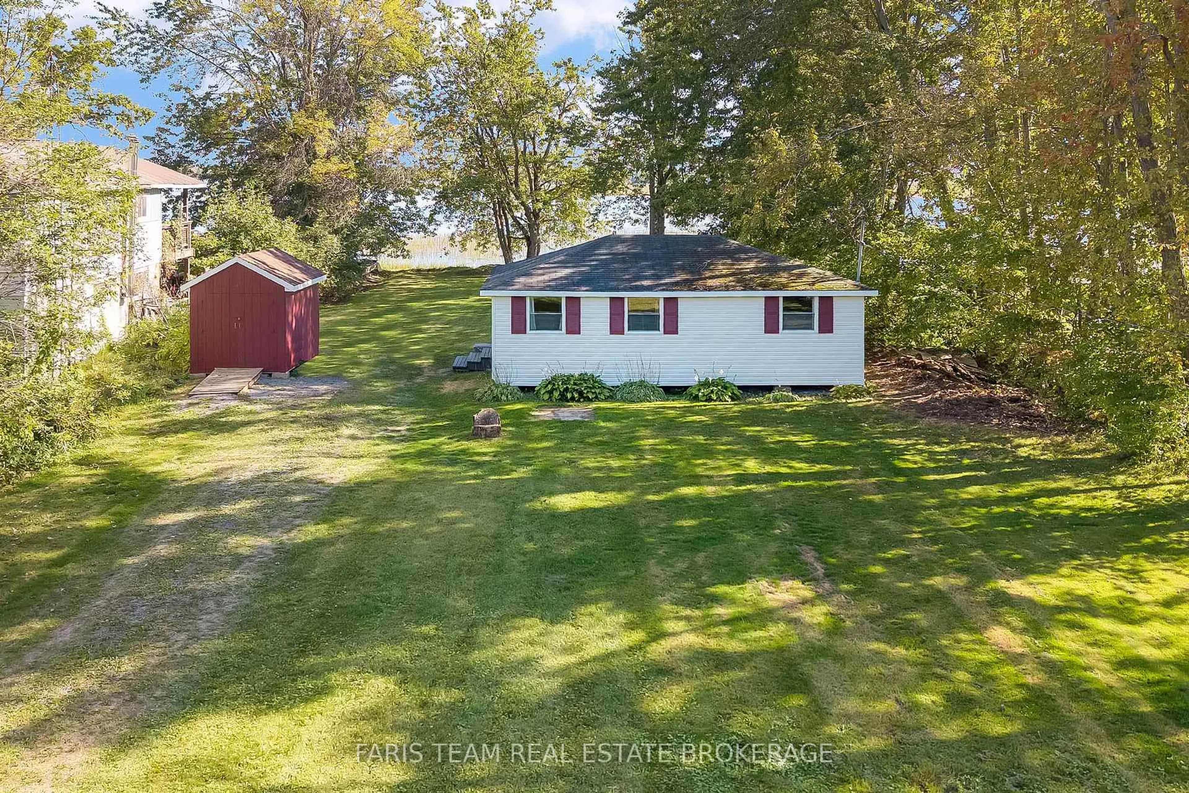 A pic from outside/outdoor area/front of a property/back of a property/a pic from drone, water/lake/river/ocean view for 1313 Carol Ann Ave, Ramara Ontario L0K 1B0