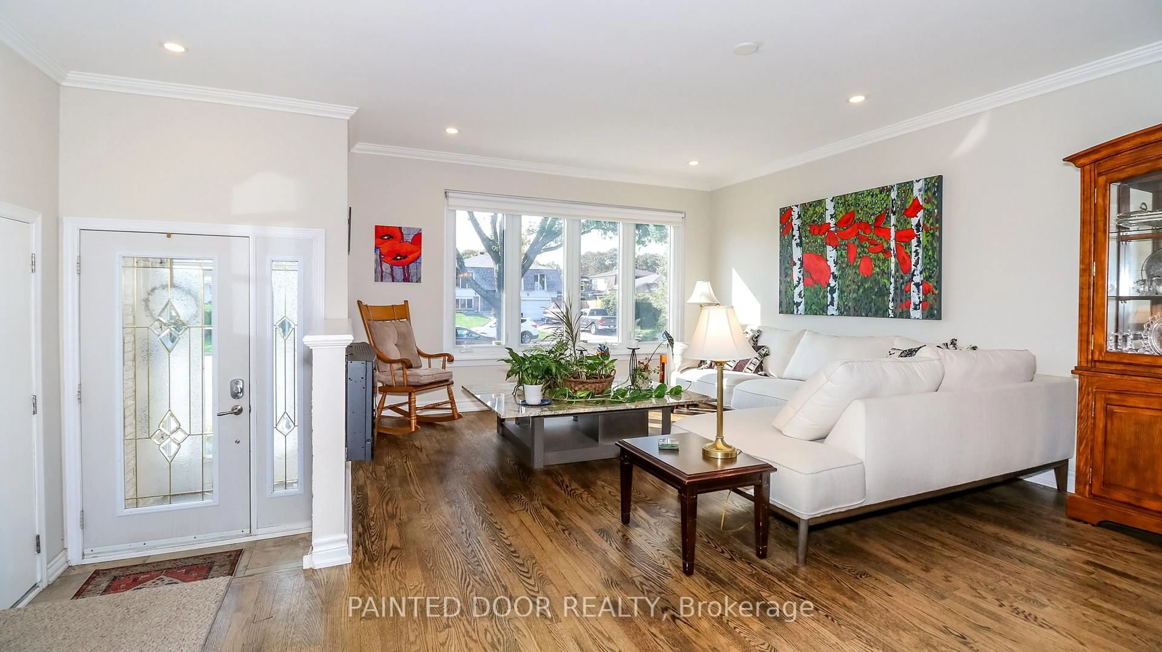 Living room with furniture, wood/laminate floor for 6 Fitzroy Terr, Barrie Ontario L4N 2Z3