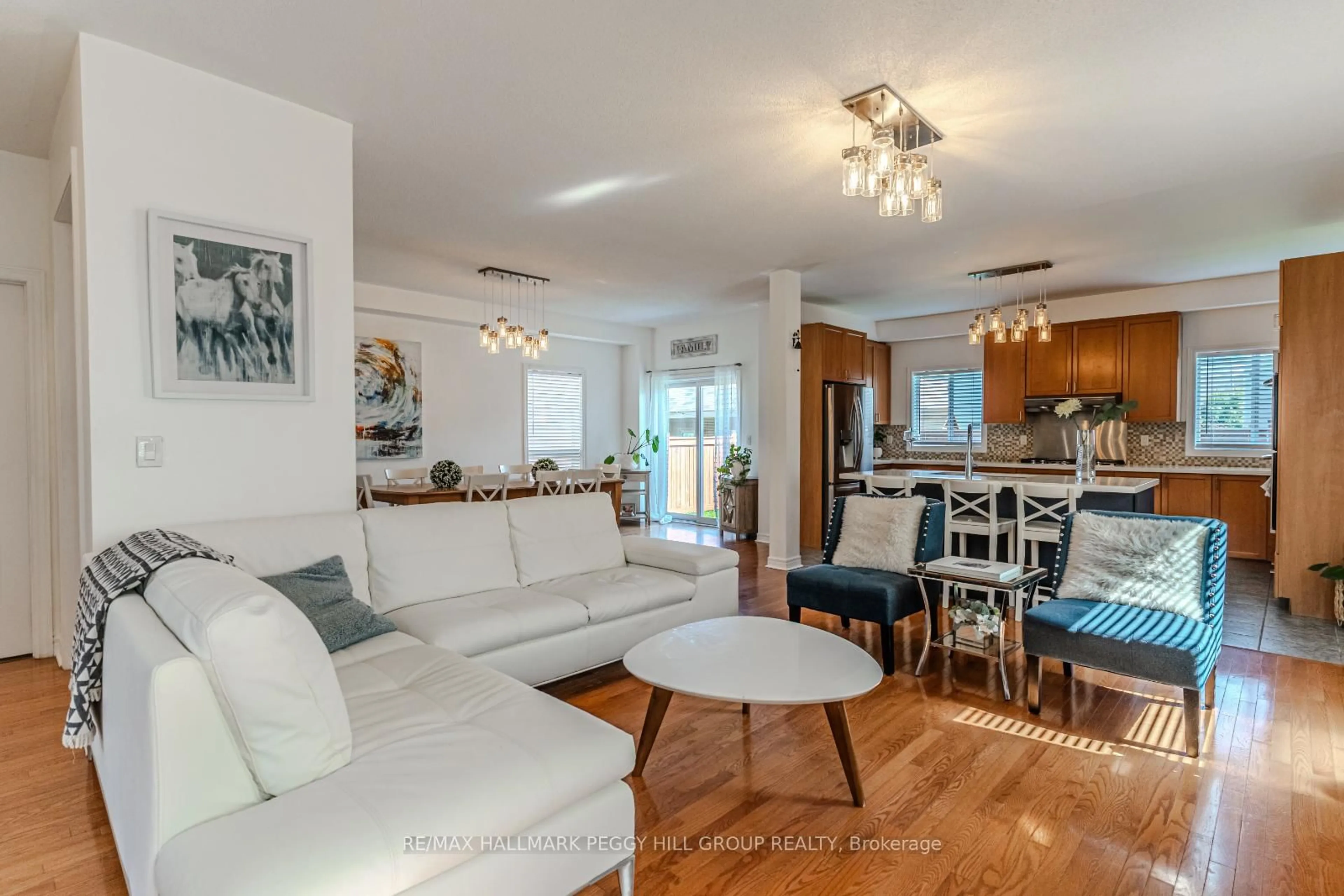 Living room with furniture, wood/laminate floor for 64 Lake Cres, Barrie Ontario L4N 6A6