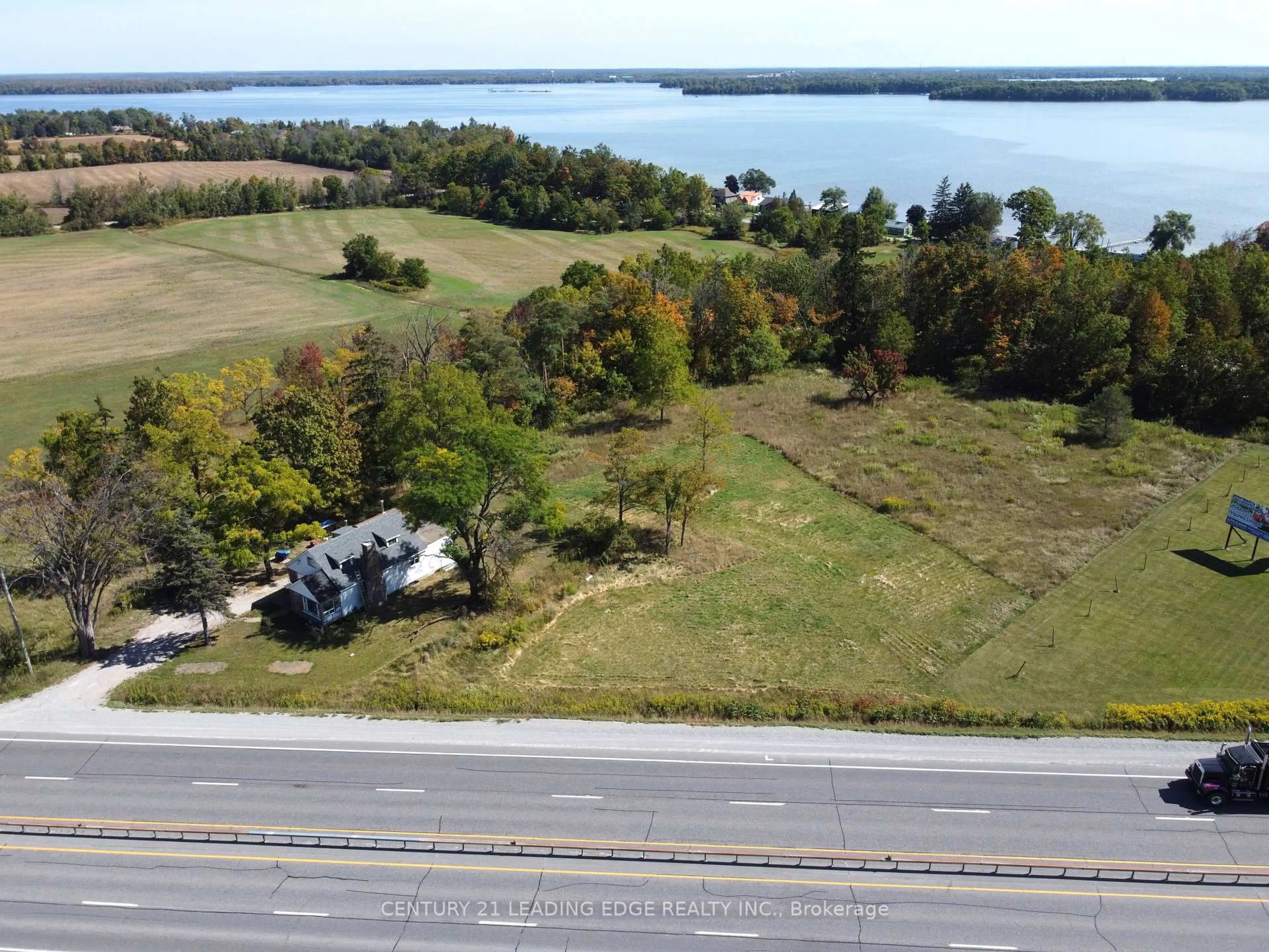 A pic from outside/outdoor area/front of a property/back of a property/a pic from drone, water/lake/river/ocean view for 8165 Highway 11 Highway, Severn Ontario L3V 0Z4