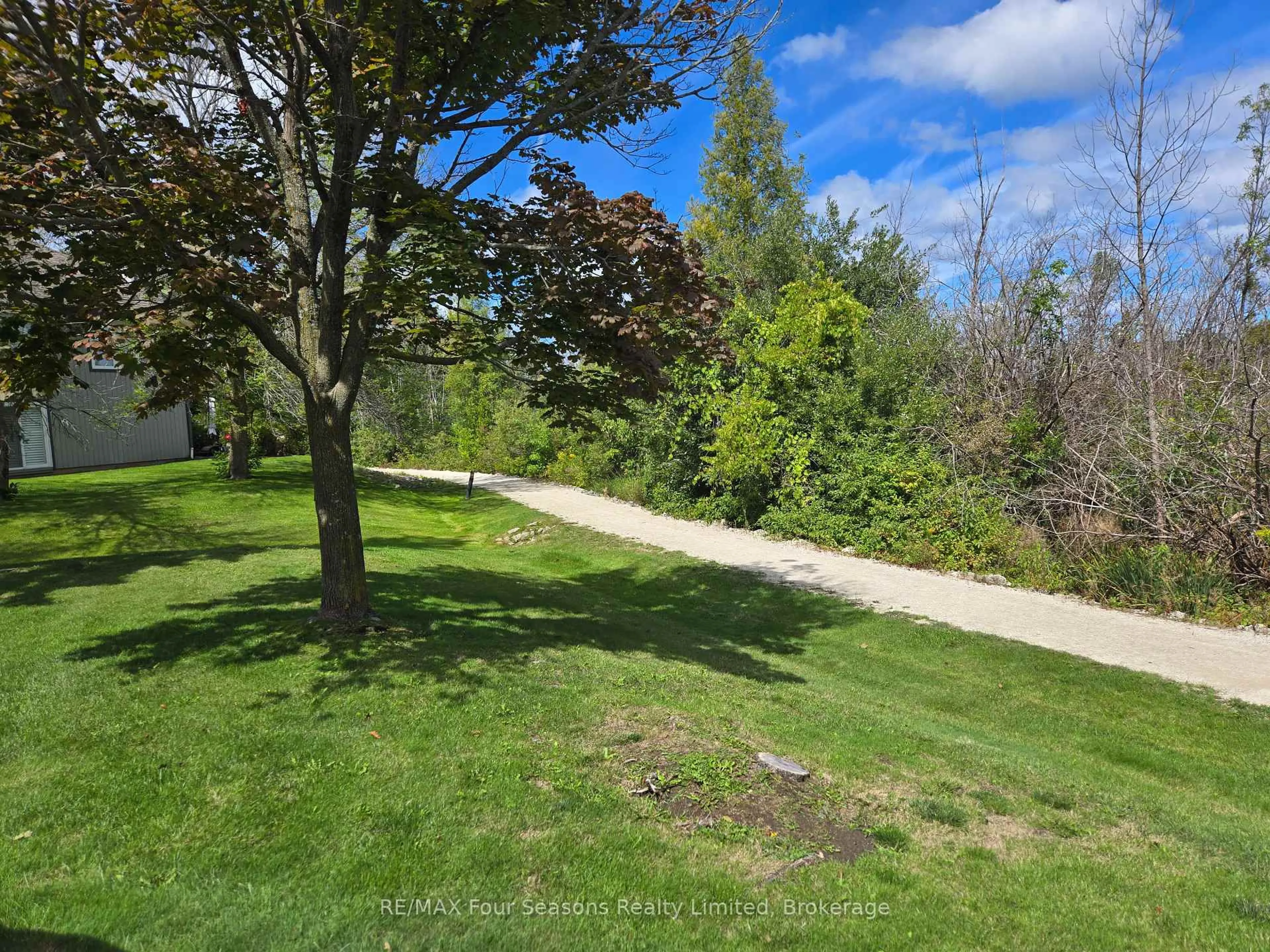 A pic from outside/outdoor area/front of a property/back of a property/a pic from drone, forest/trees view for 750 Johnston Park Ave #3005, Collingwood Ontario L9Y 5C7