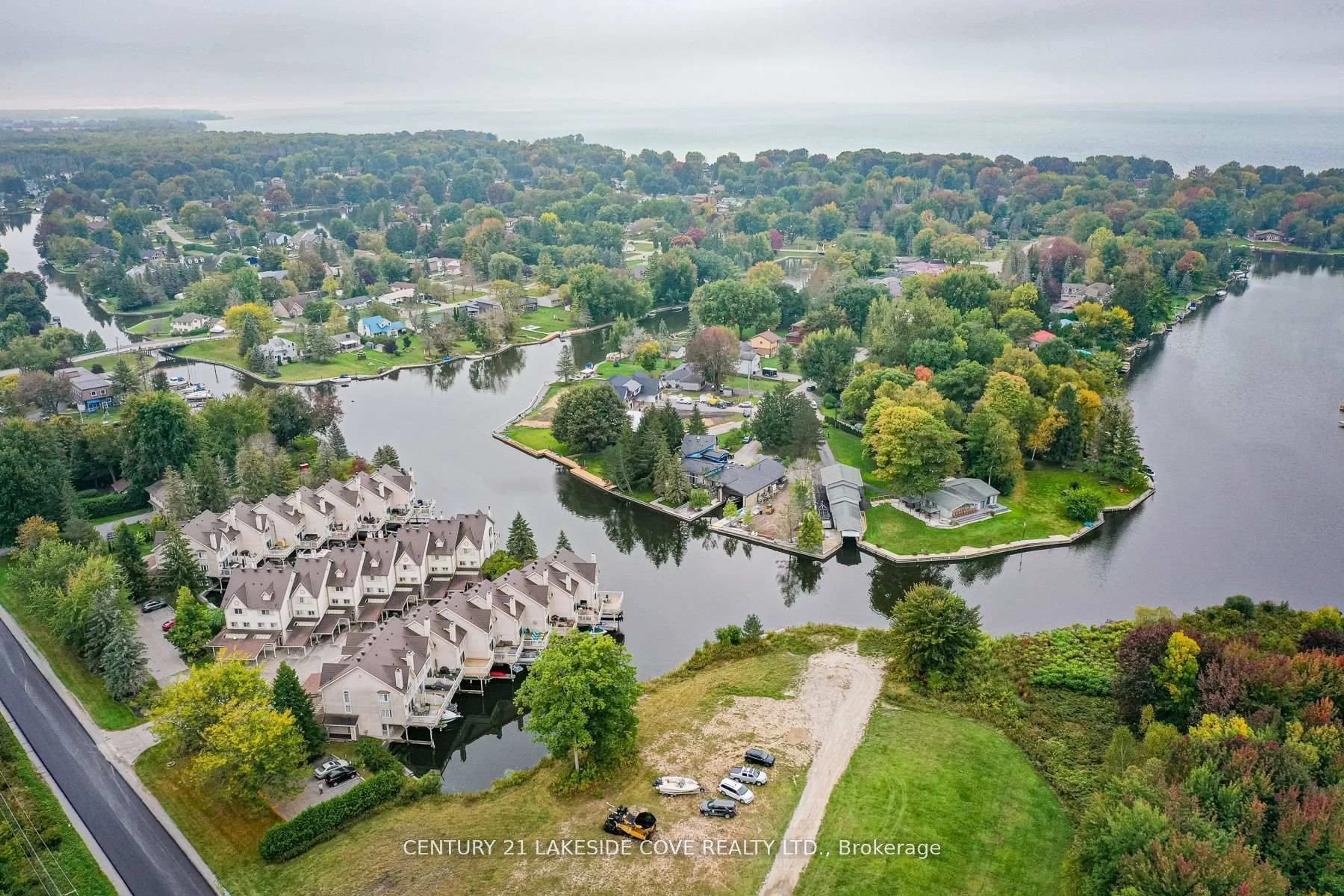 A pic from outside/outdoor area/front of a property/back of a property/a pic from drone, water/lake/river/ocean view for 100 Laguna Pkwy #23, Ramara Ontario L0K 1B0