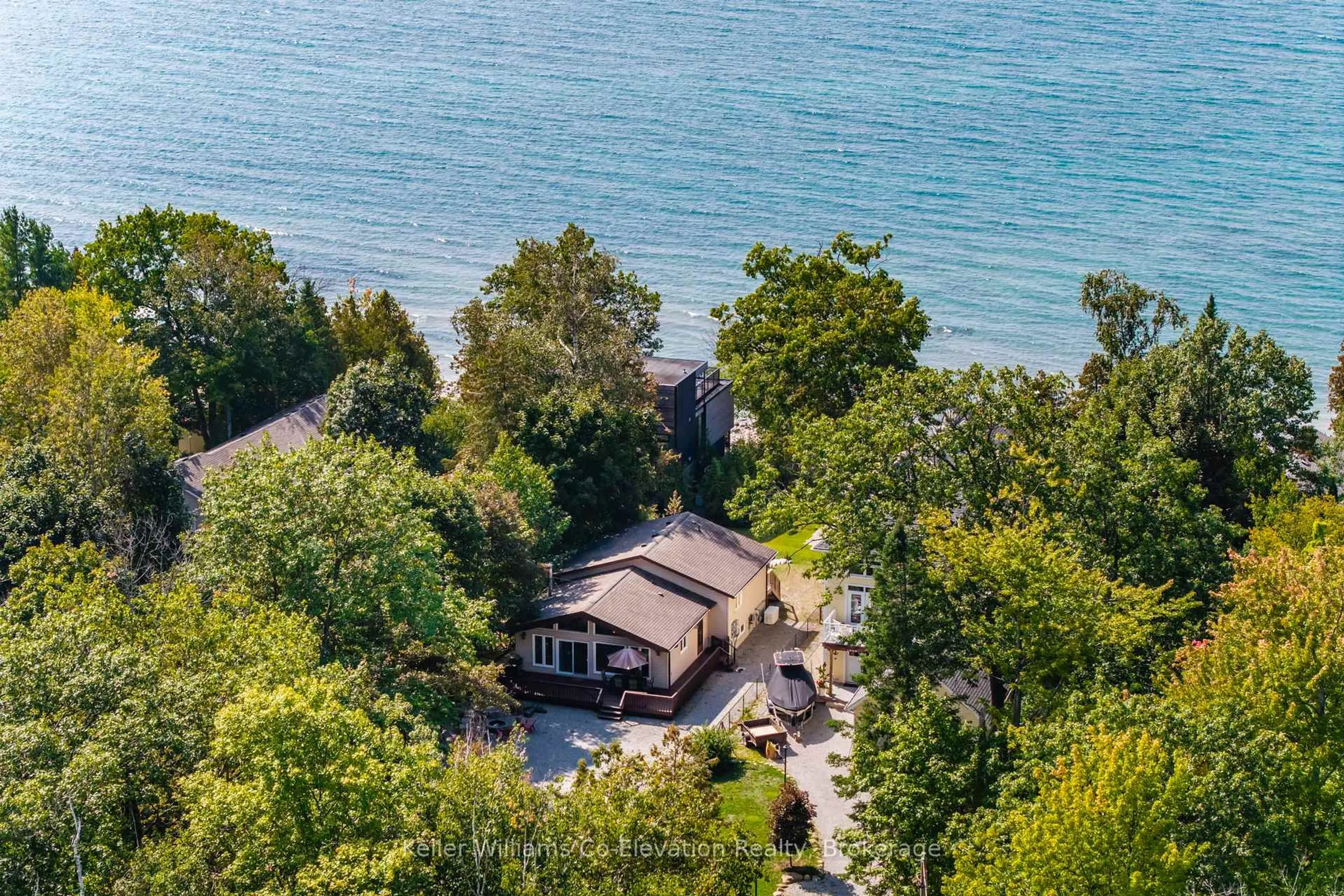 A pic from outside/outdoor area/front of a property/back of a property/a pic from drone, water/lake/river/ocean view for 1948 Tiny Beaches Road South Rd, Tiny Ontario L0L 1P1