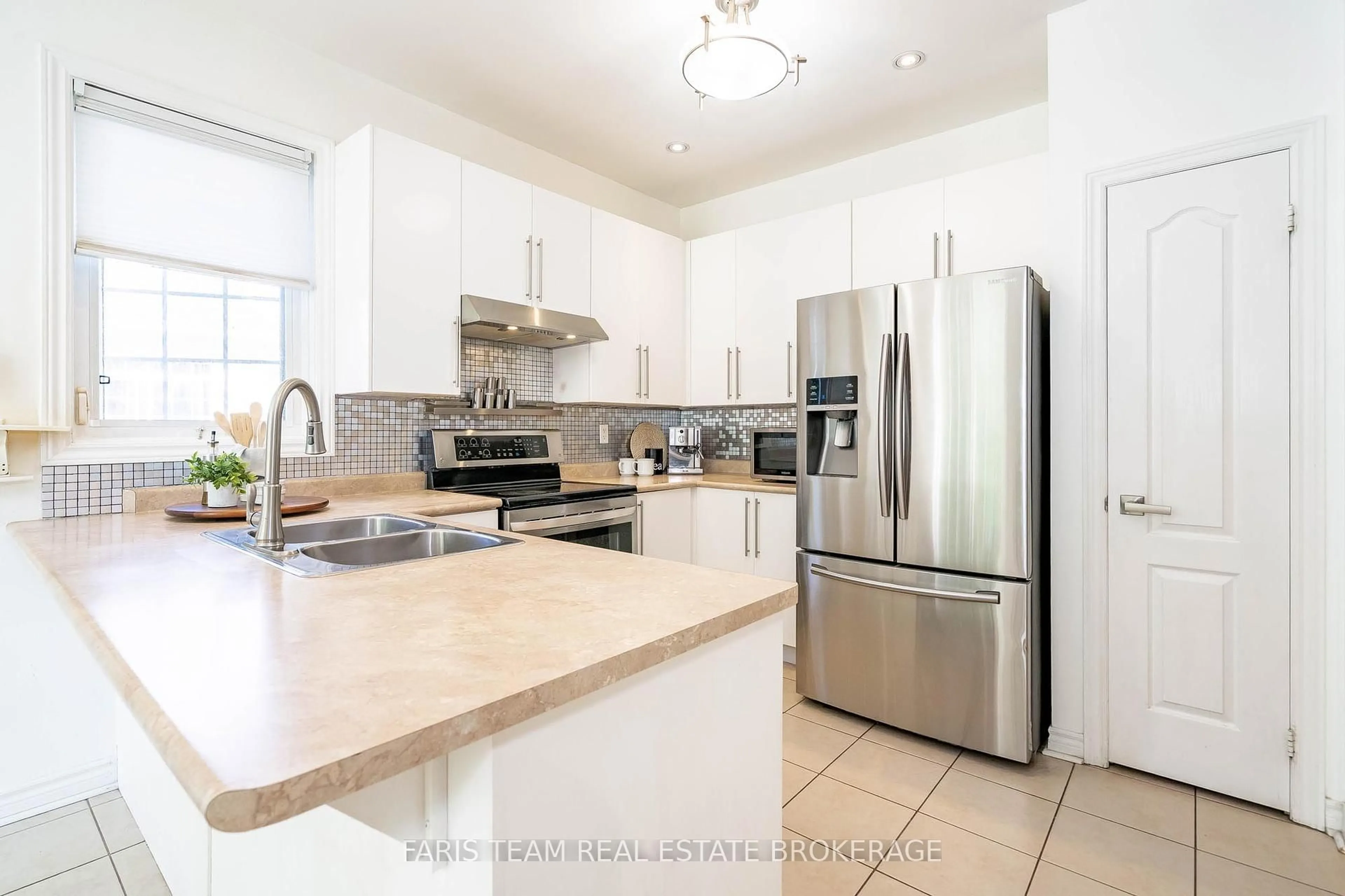 Open concept kitchen, ceramic/tile floor for 103 41st St, Wasaga Beach Ontario L9Z 3B6