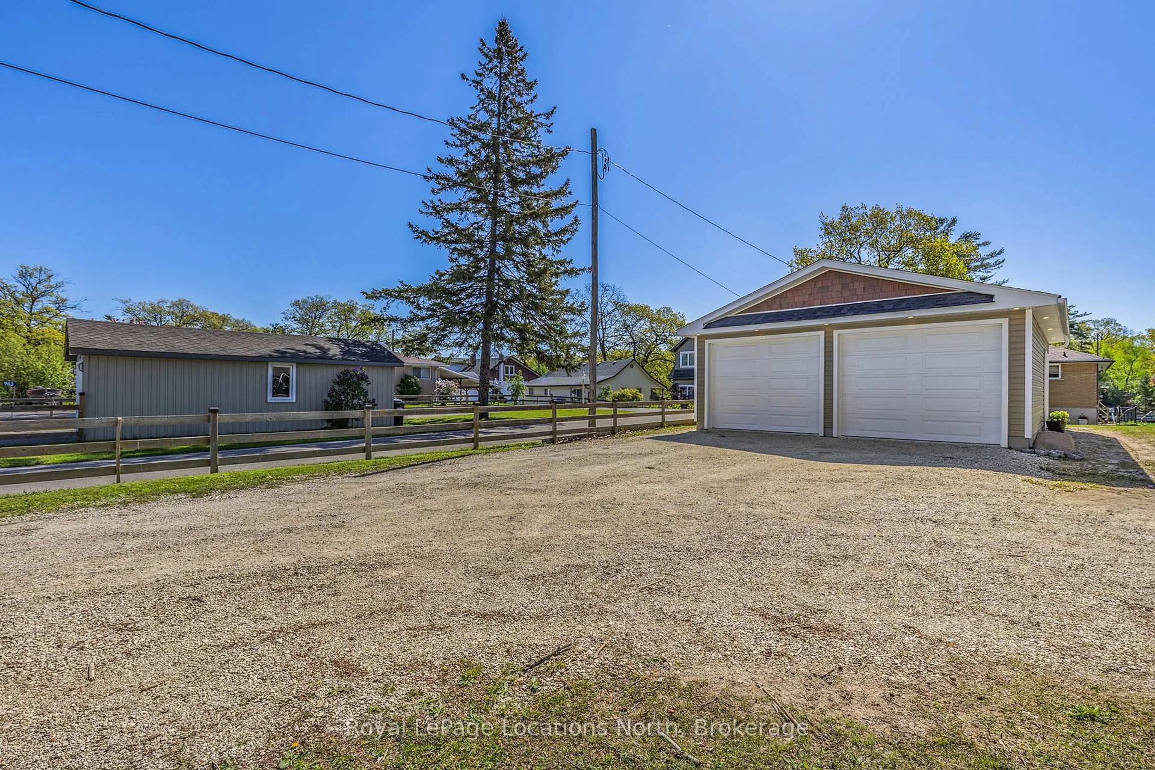 A pic from outside/outdoor area/front of a property/back of a property/a pic from drone, street for 971 Mosley St, Wasaga Beach Ontario L9Z 2G9