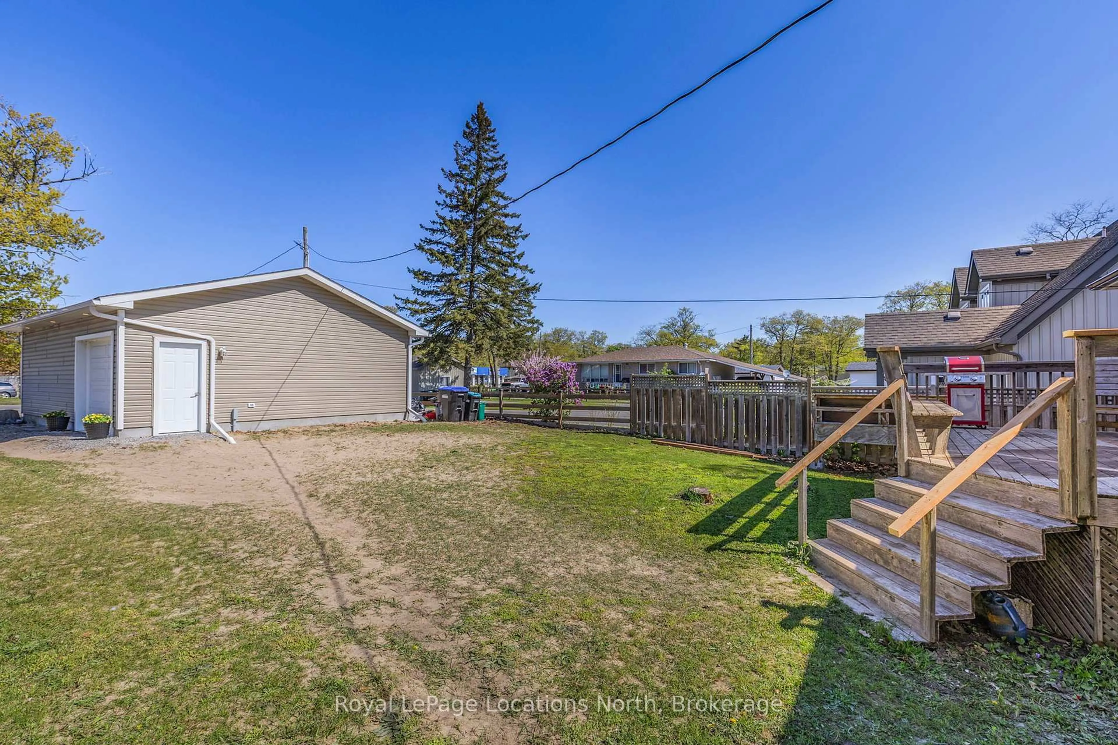 A pic from outside/outdoor area/front of a property/back of a property/a pic from drone, unknown for 971 Mosley St, Wasaga Beach Ontario L9Z 2G9