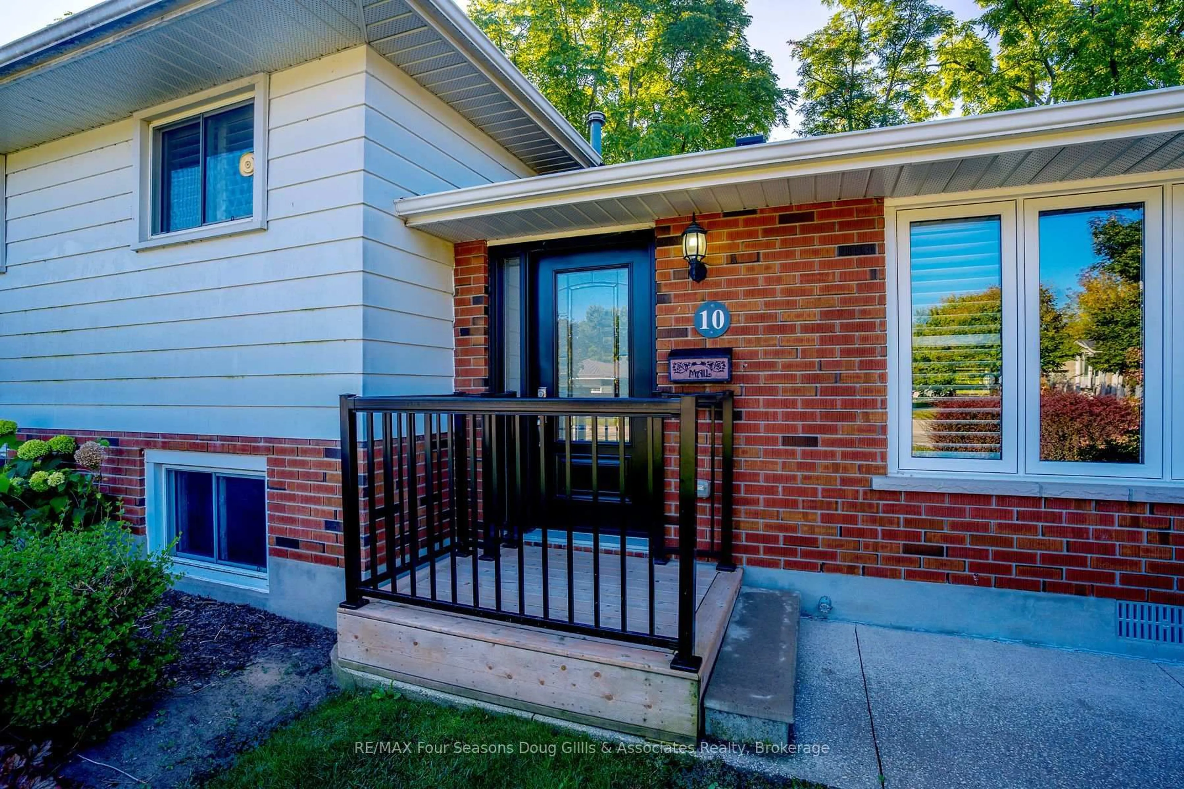 Home with brick exterior material, street for 10 Lockhart Rd, Collingwood Ontario L9Y 4B5