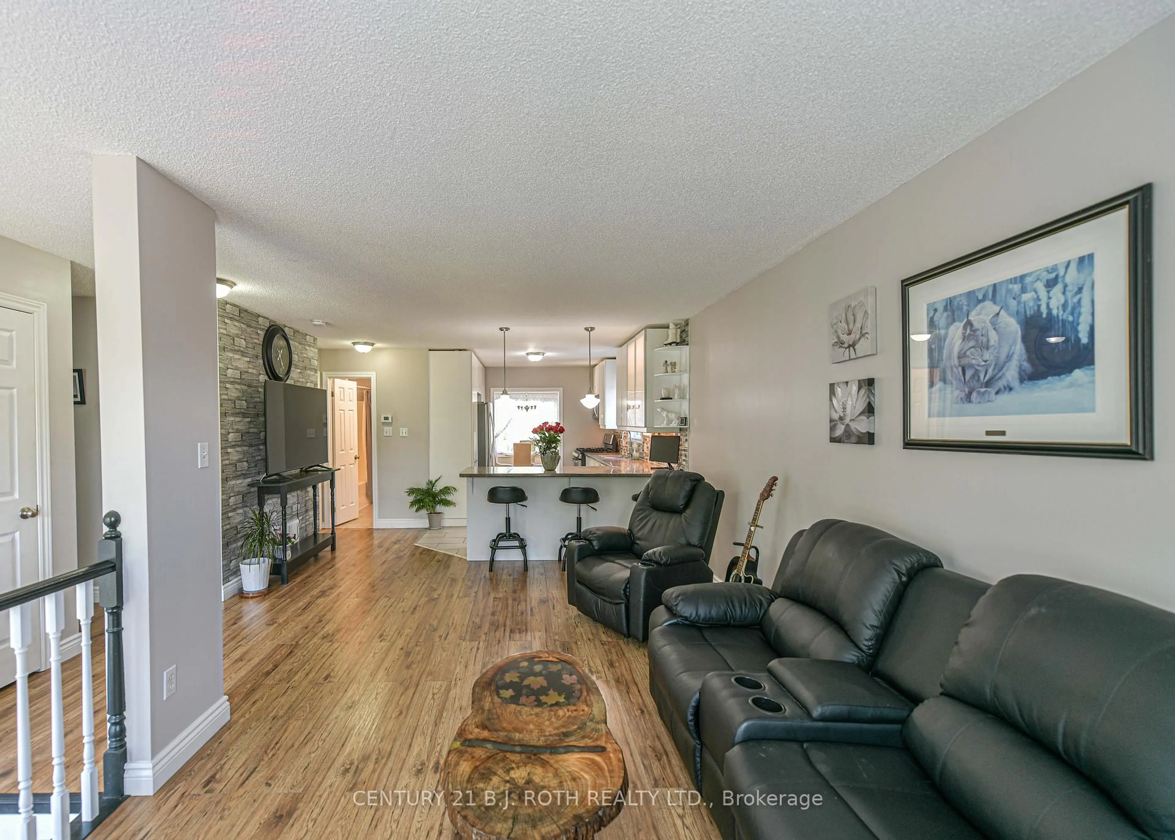 Living room with furniture, wood/laminate floor for 7576 Cronk Sdrd, Ramara Ontario L0K 2B0