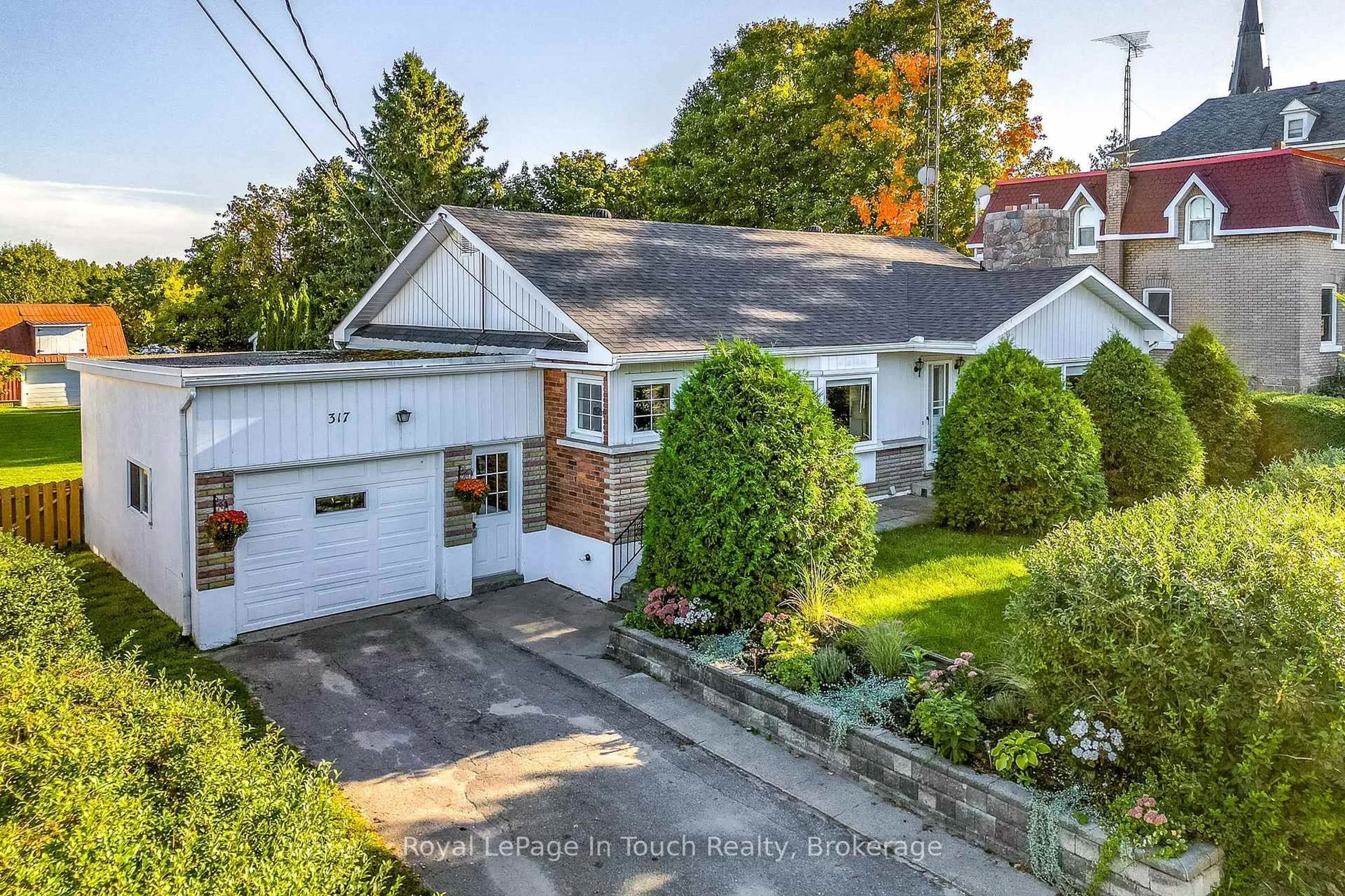 A pic from outside/outdoor area/front of a property/back of a property/a pic from drone, street for 317 Lafontaine Rd, Tiny Ontario L9M 0H1